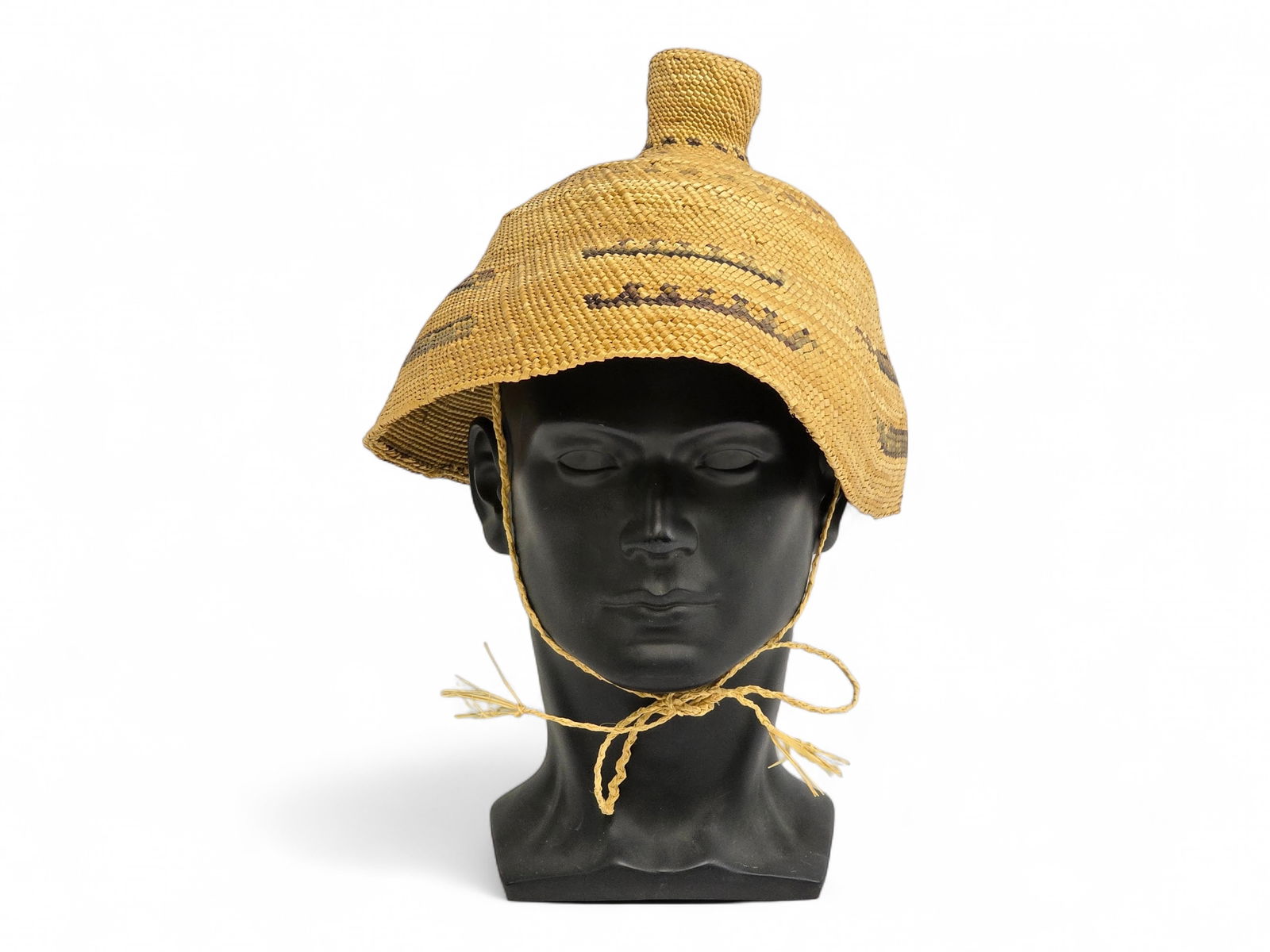 Makah/Nootka Woven & Twined Whaling Hat: An early 20th century Makah/Nootka whaling hat made of woven and twined plant fibers, possibly cedar bark and sedge. Highly functional, designed to shed water effectively and provide protection from t