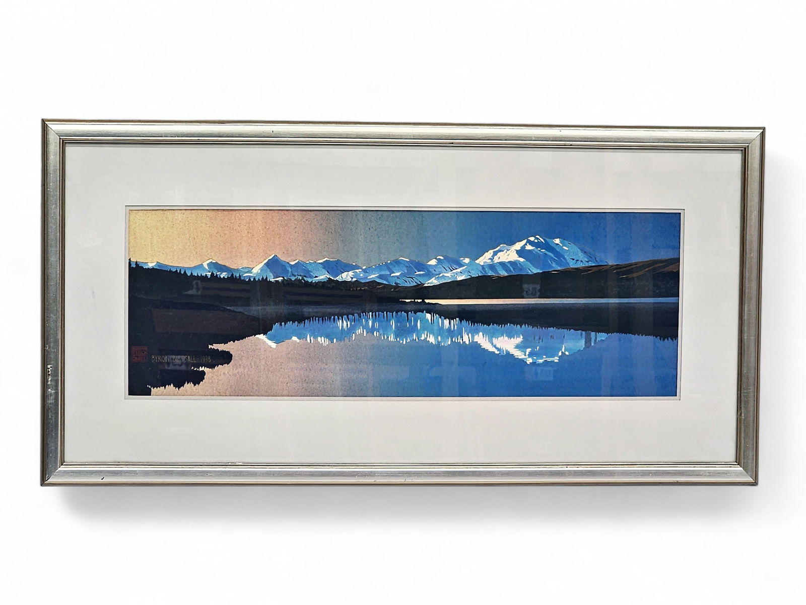 Byron Birdsall Watercolor Painting of Denali Sunset: An original watercolor on paper by the renowned Alaskan artist, Byron Birdsall (1937-2016). The painting depicts a panoramic view of Mount Denali, a soft sunset in the upper left corner, all