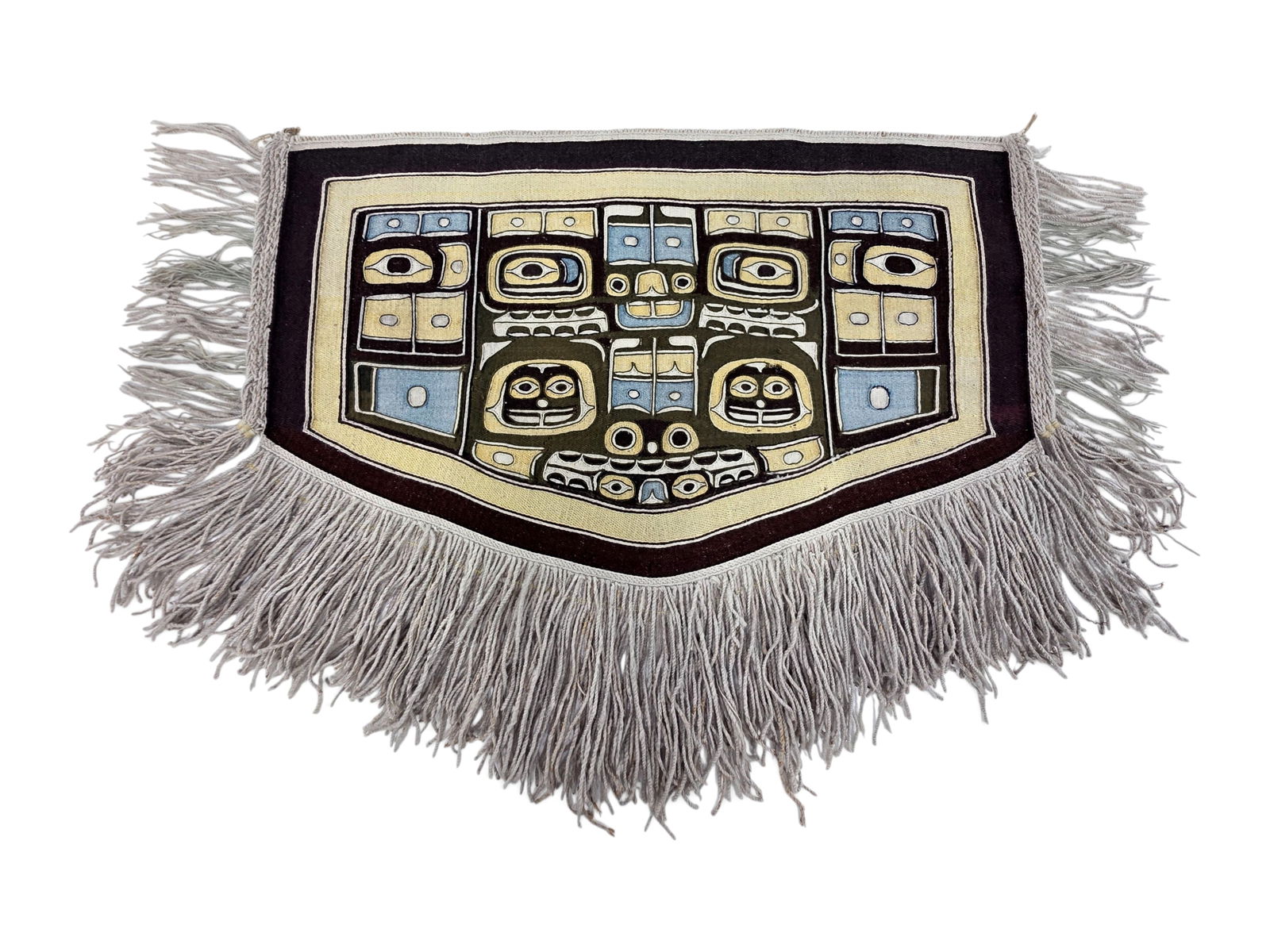 A Child's Tlingit Ceremonial Robe (Chilkat Blanket): An important and finely woven antique Tlingit Chilkat ceremonial dance blanket of child’s size, executed in mountain goat wool with cedar bark, in soft yellow, light turquoise, and black, with long