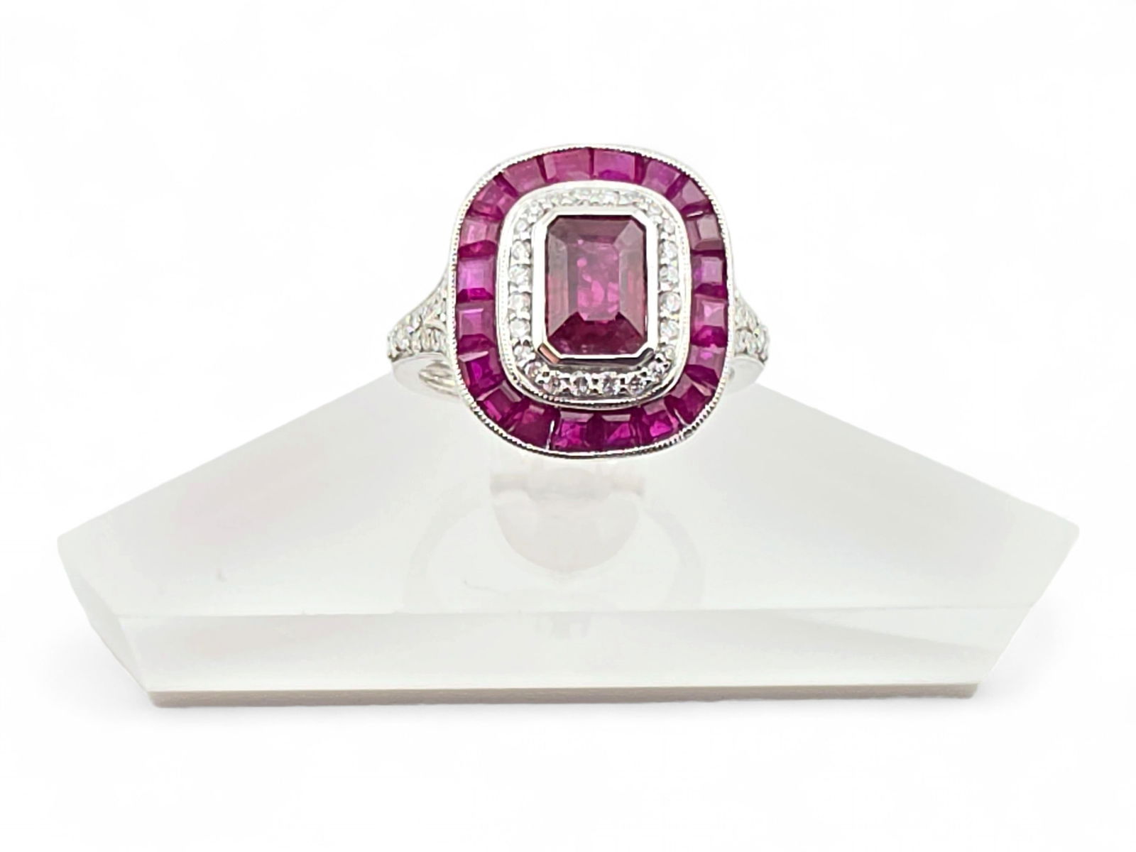 3.17 ctw Ruby Halo Statement Ring in .950 Platinum - Size 6.75: A stunning size 6.75 statement ring in .950 platinum featuring octagonal step and square cut natural ruby corundum gemstones, plus round brilliant cut diamond, in a halo setting with additional