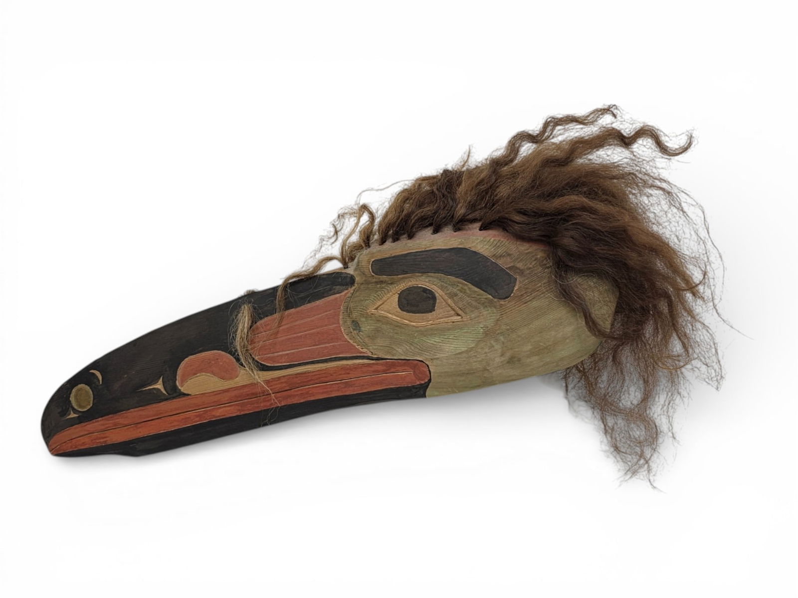 Tlingit Wooden Raven Mask - James M. Williams, Jr.: A Tlingit wooden mask, hand-painted and adorned with fur plugs upon the top and back of the head. Titled "Raven Mask" and signed c.1992 on the underside by contemporary carver and blacksmith James M.