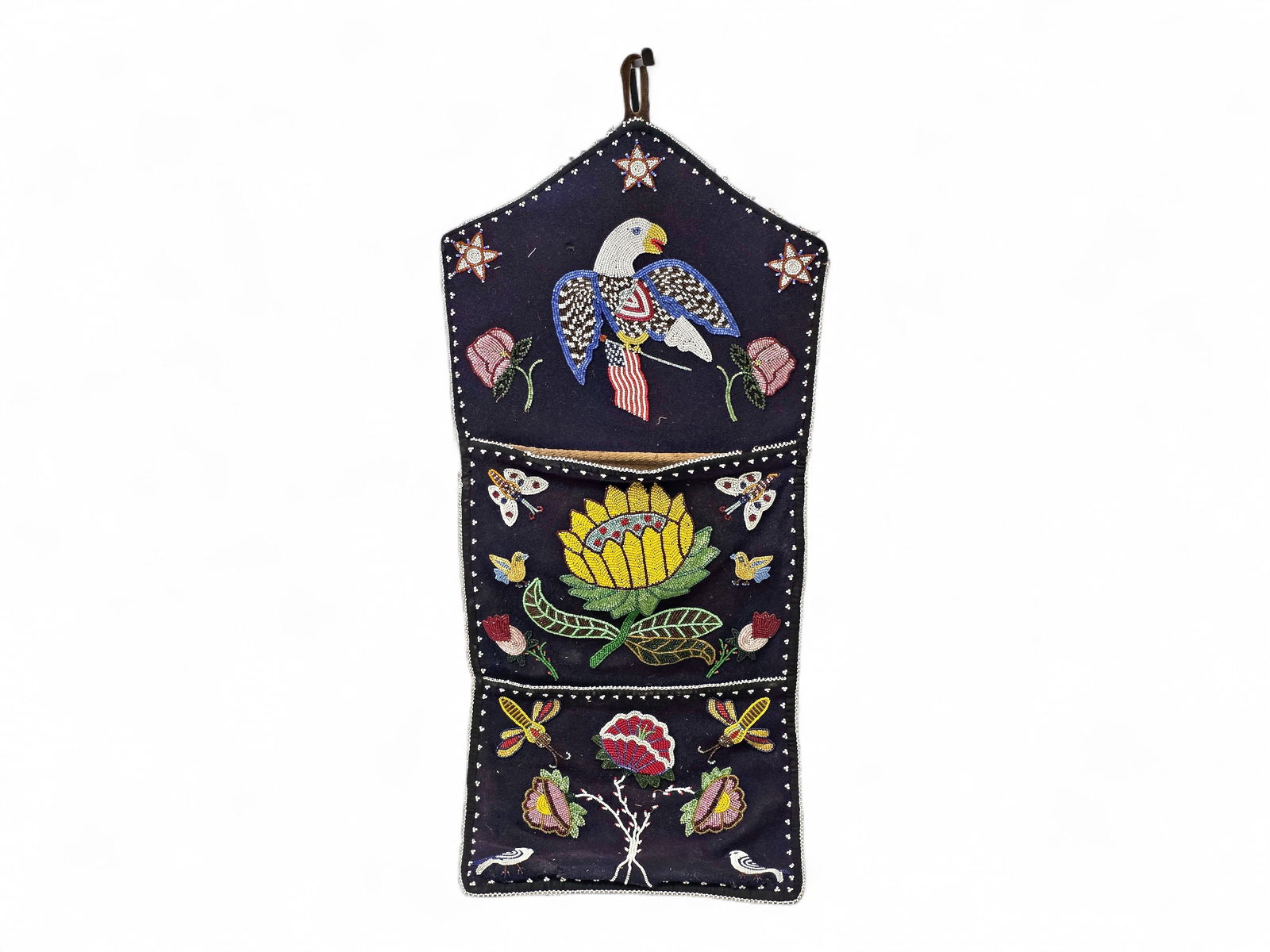 Antique Tlingit Beaded Wall Pocket: A very fine Tlingit wall pocket, circa 1900-1920, a household accessory that provides storage for small items and features distinctive needlework and beaded artistry. This example features an eagle,