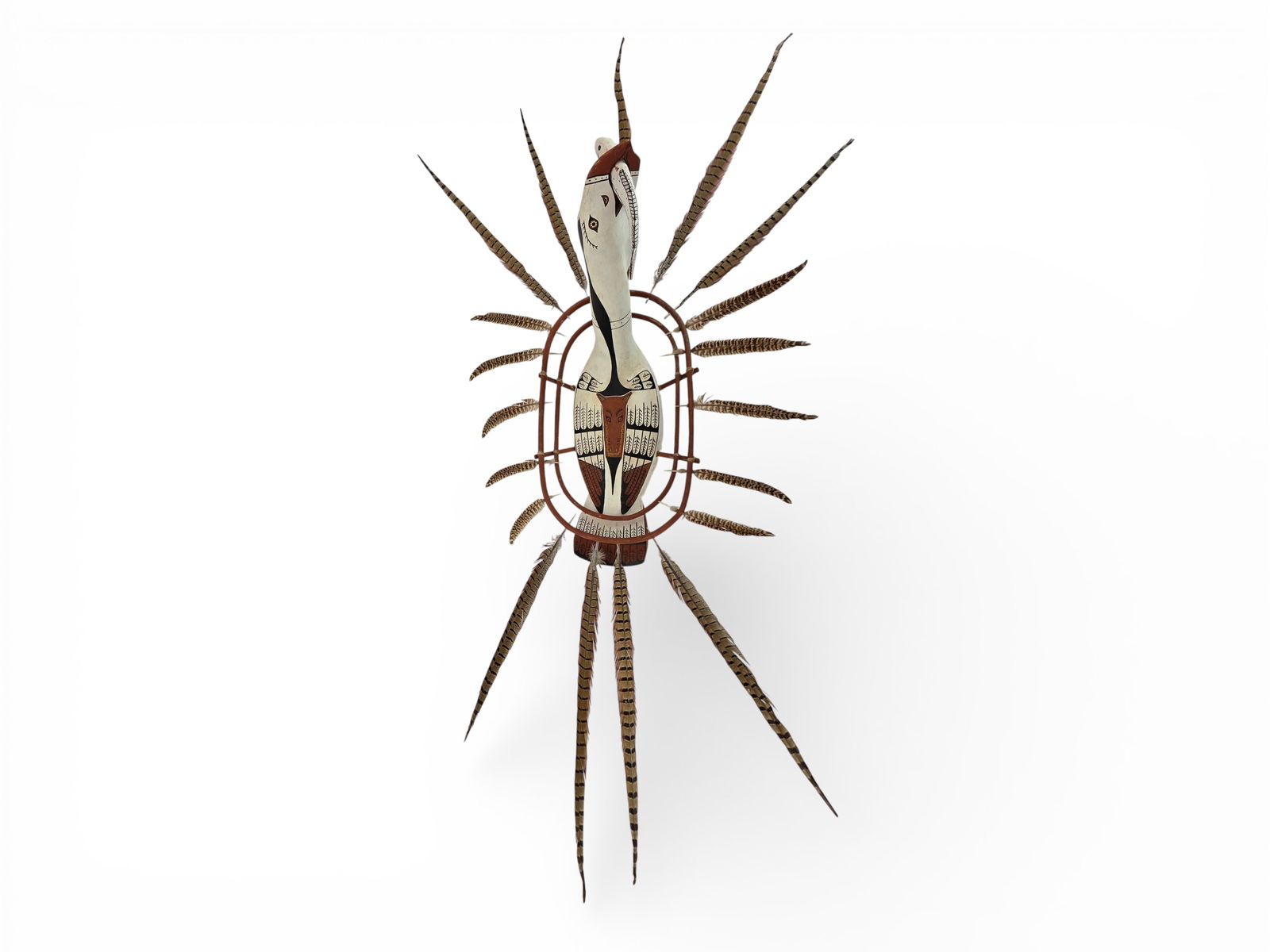 Unusual Nunivak Island Polychrome Wooden Loon Spirit Mask: A life-size Nunivak Island polychrome wooden spirit mask with carved loon body, painted with precise details upon the wings and back. The loon grasps a fish within its mouth, and is suspended via four