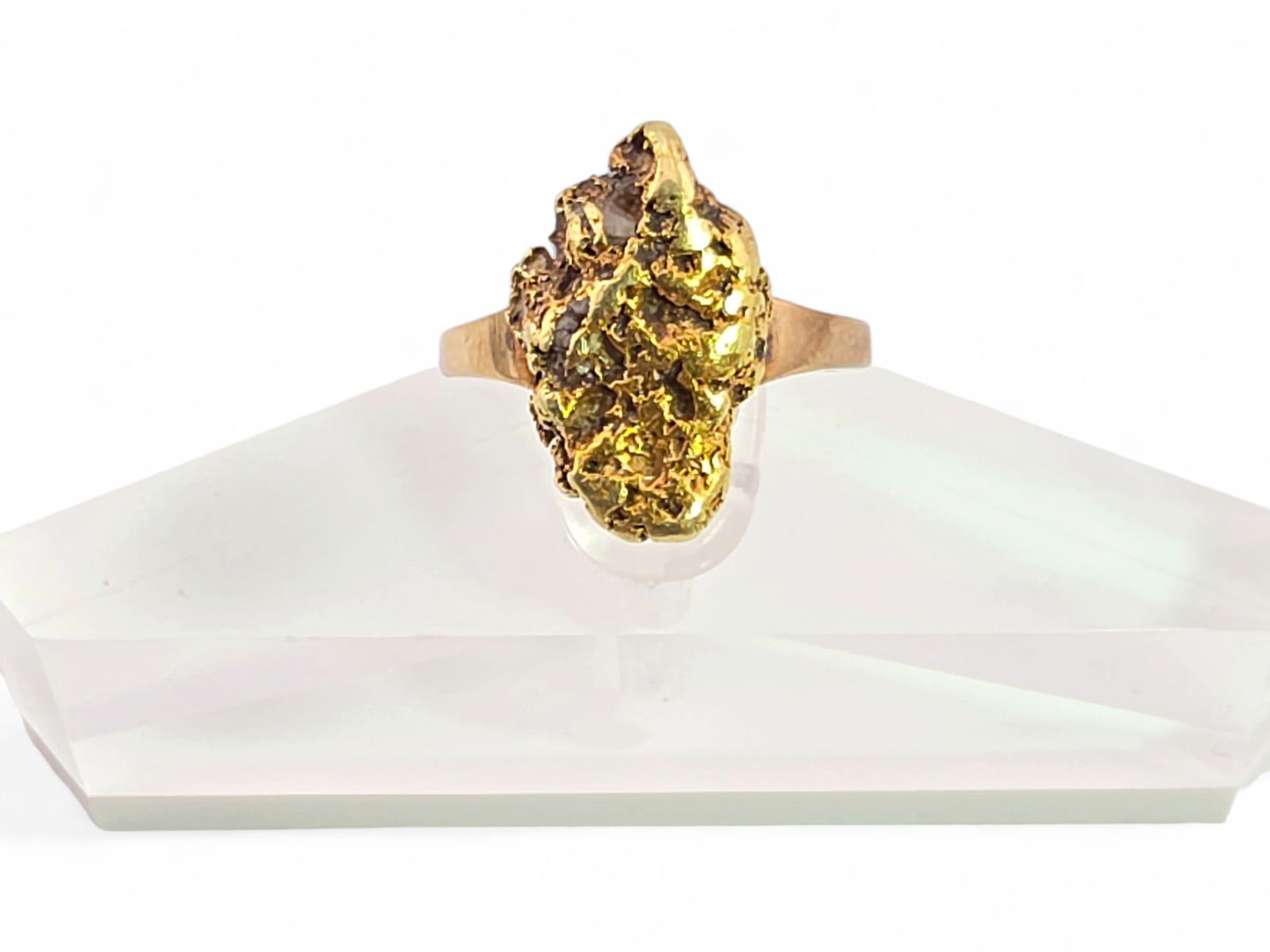 Alaska Gold Nugget & 10k Yellow Gold Ring - Size 4.75: A size 4.75 statement ring featuring an elongated Alaska gold nugget on a 10 karat yellow gold band. Total weight of 5.52 grams.