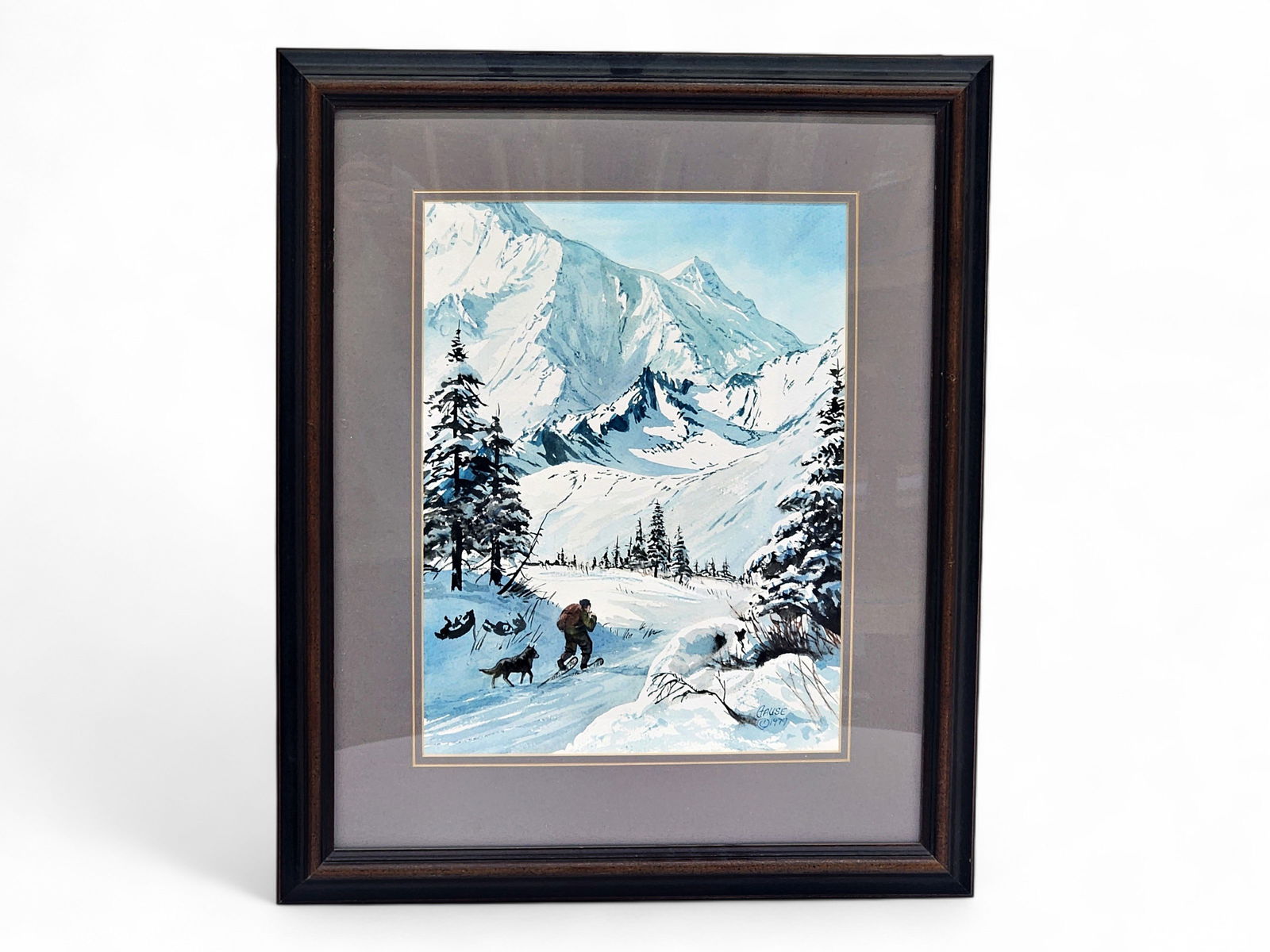 Charles Gause "The Hikers" Watercolor Painting: An original watercolor painting titled "The Hikers" and depicting a man snowshoeing across snow-covered mountains accompanied by a dog, signed lower right by Alaska artist Charles Gause (b.1955).