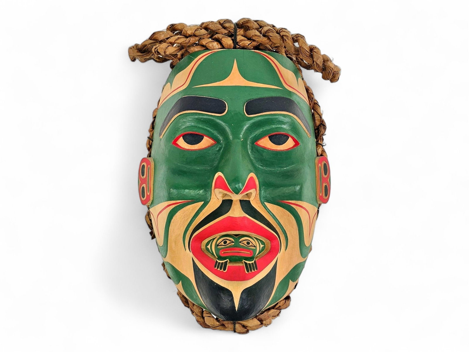 Kwakwaka'wakw Frog Transformation Mask – Wayne Alfred: A Northwest Coast Frog Transformation mask by renowned Kwakwaka'wakw artist Wayne Alfred (b. 1958), signed en verso and dated 2009. Finely carved from cedar, the mask depicts a stylized human face fro