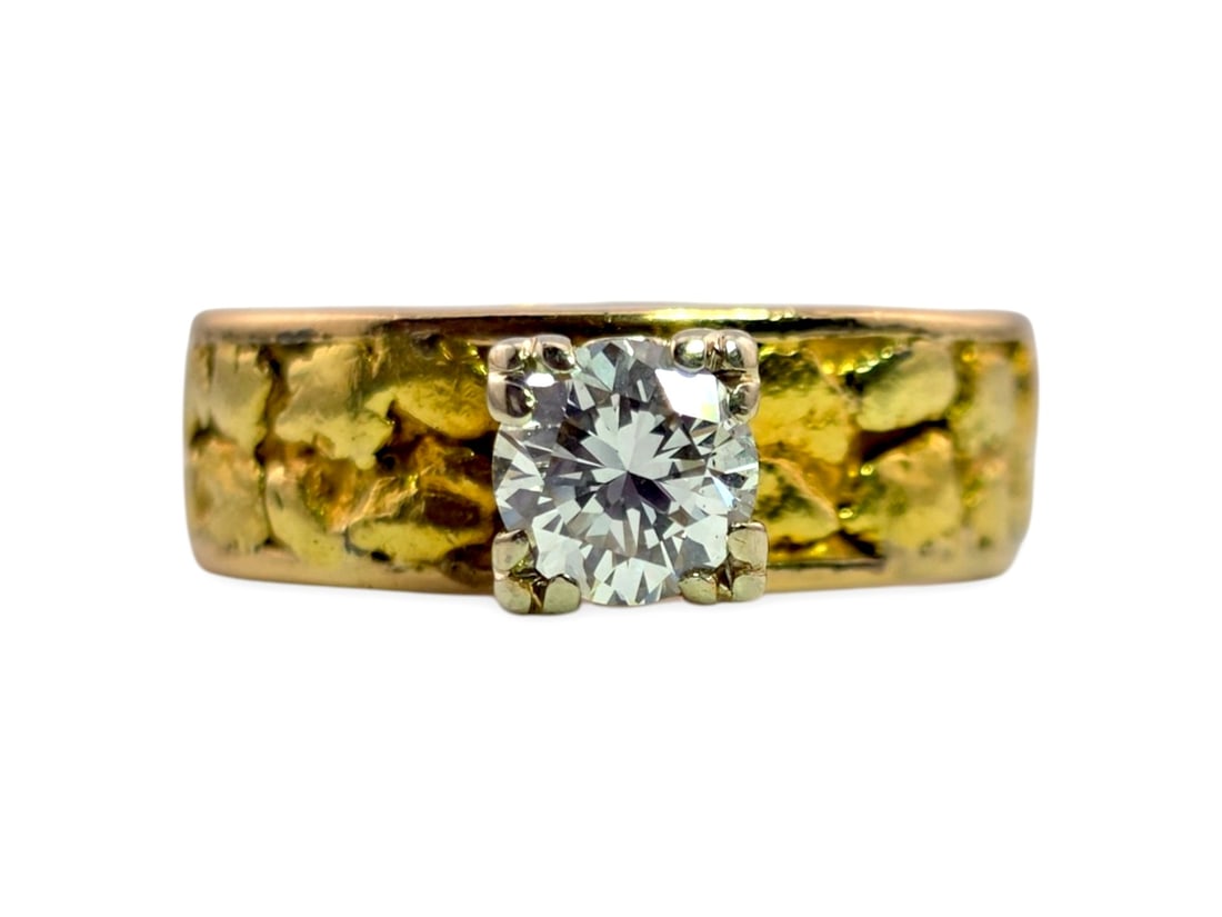 14K Gold & Alaskan Gold Nugget Ring w/ 0.50 CT Diamond: A striking size 5.25 ring crafted in 14-karat yellow gold and set with natural Alaskan gold nuggets integrated into a substantial tapering band. Centered within a white gold six-prong mounting is a ro