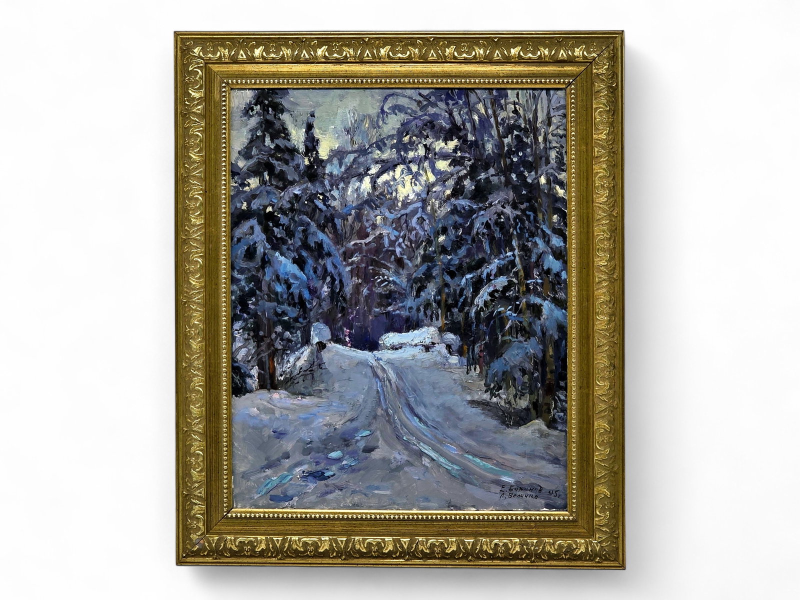 Evgeny & Lydia Velichko Baranov "Winter Bridge" Oil Painting: An original oil on canvas painting entitled "Winter Bridge" by Evgeny and Lydia Velichko Baranov (Russian, 21st Century). The artwork features a serene path through a thick evergreen forest blanketed 