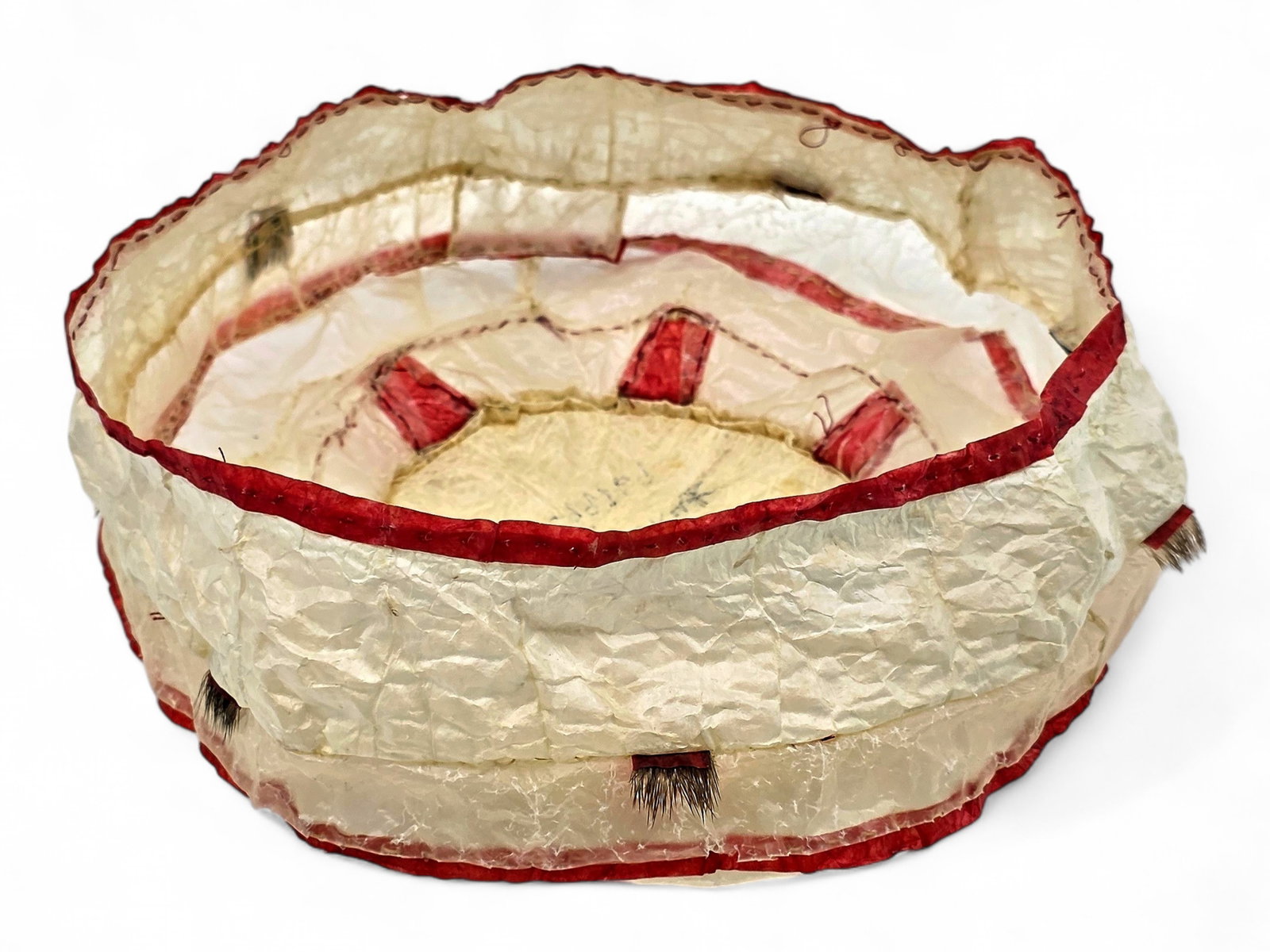 St. Lawrence Island Walrus Gut Basket - Elaine Kingeekuk: A walrus gut sewing basket by celebrated St. Lawrence Island Yup'ik artist Elaine Kingeekuk of Savoonga, Alaska. A master skin sewer and cultural educator, Kingeekuk was honored with the 2021 Museums 