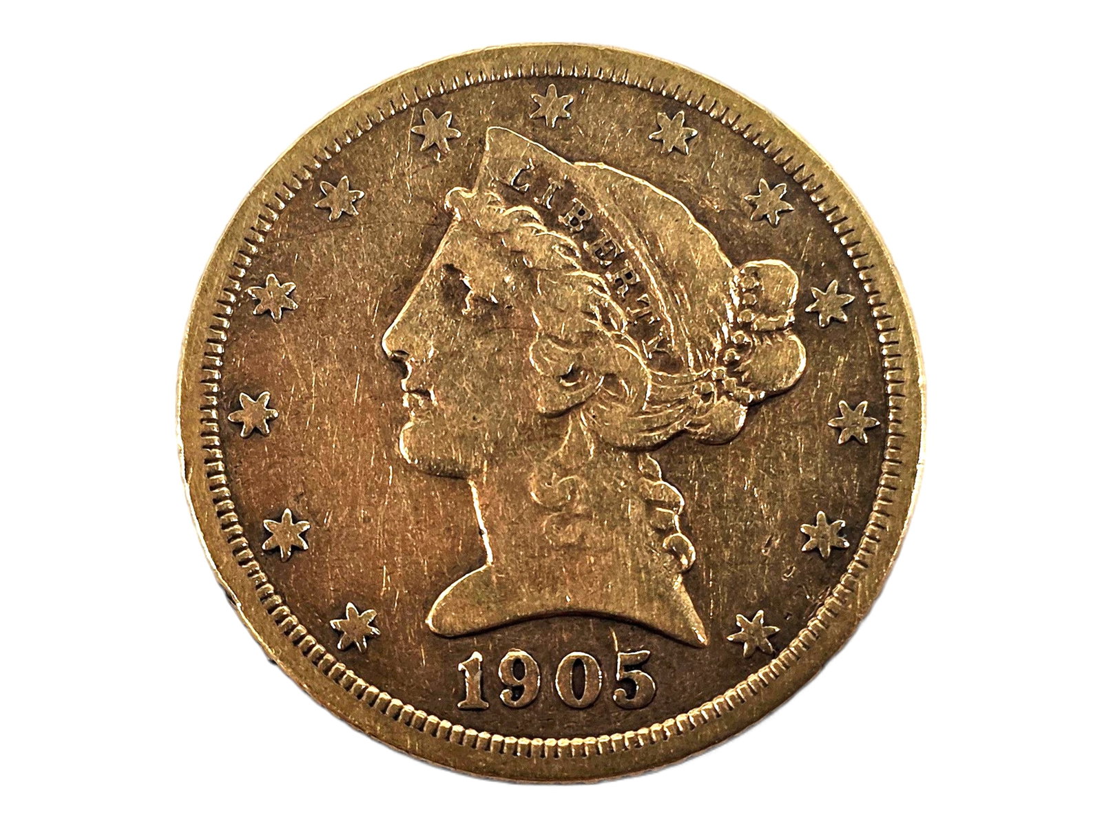 1905 Coronet Head Five Dollar Gold Half Eagle: An antique 1905-S Coronet Head Gold Half Eagle depicting Liberty facing left and encircled by thirteen stars on the obverse, with a heraldic eagle bearing the Union shield on the reverse. Designed by 
