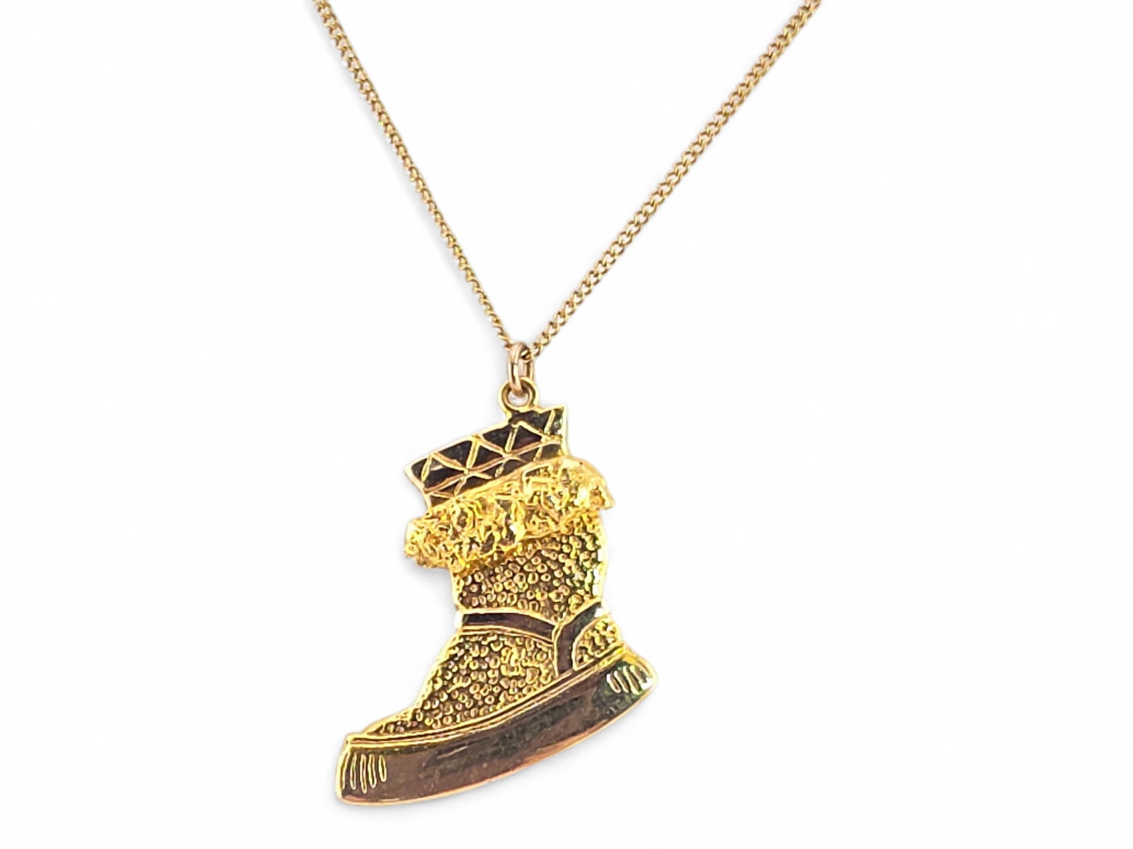 10K Gold & Alaskan Gold Nugget Mukluk Pendant Necklace: A charming 10-karat yellow gold pendant in the form of a traditional mukluk boot, a design long favored by Alaska jewelers and inspired by the fur-trimmed winter footwear used throughout the Arctic. T