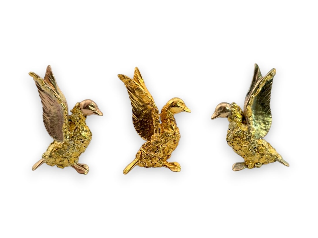 Three-Piece 10K Gold & Alaskan Gold Nugget Waterfowl Jewelry Suite: A charming three-piece jewelry suite depicting ducks in flight, each crafted in 10-karat yellow gold with richly textured natural gold nugget bodies and polished gold heads, wings, and feet. The set i