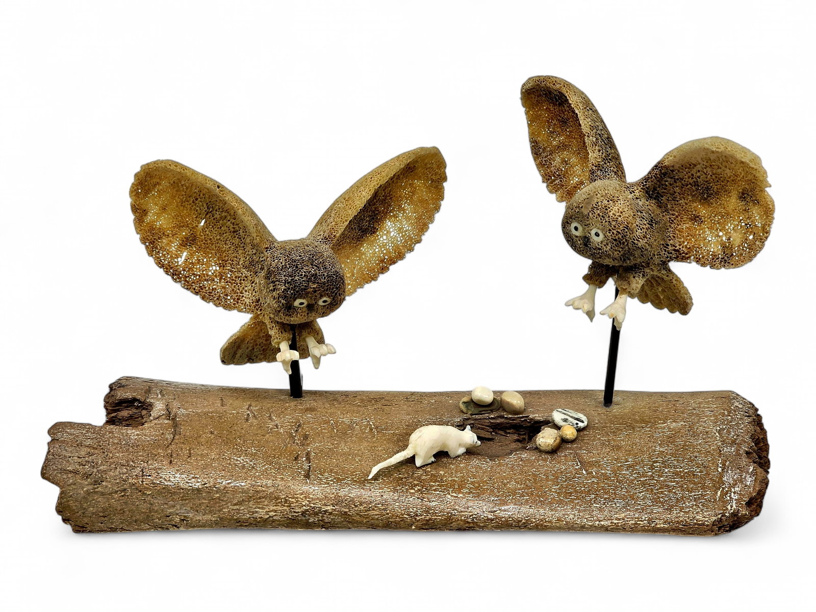Snowy Owl Hunting Scene Diorama - Edward Tocktoo: A carved diorama by Inupiaq artist Edward Tocktoo (b. 1969) of Shishmaref, Alaska, depicting a pair of snowy owls suspended in flight as they descend toward their prey. Each owl is carved from fossili