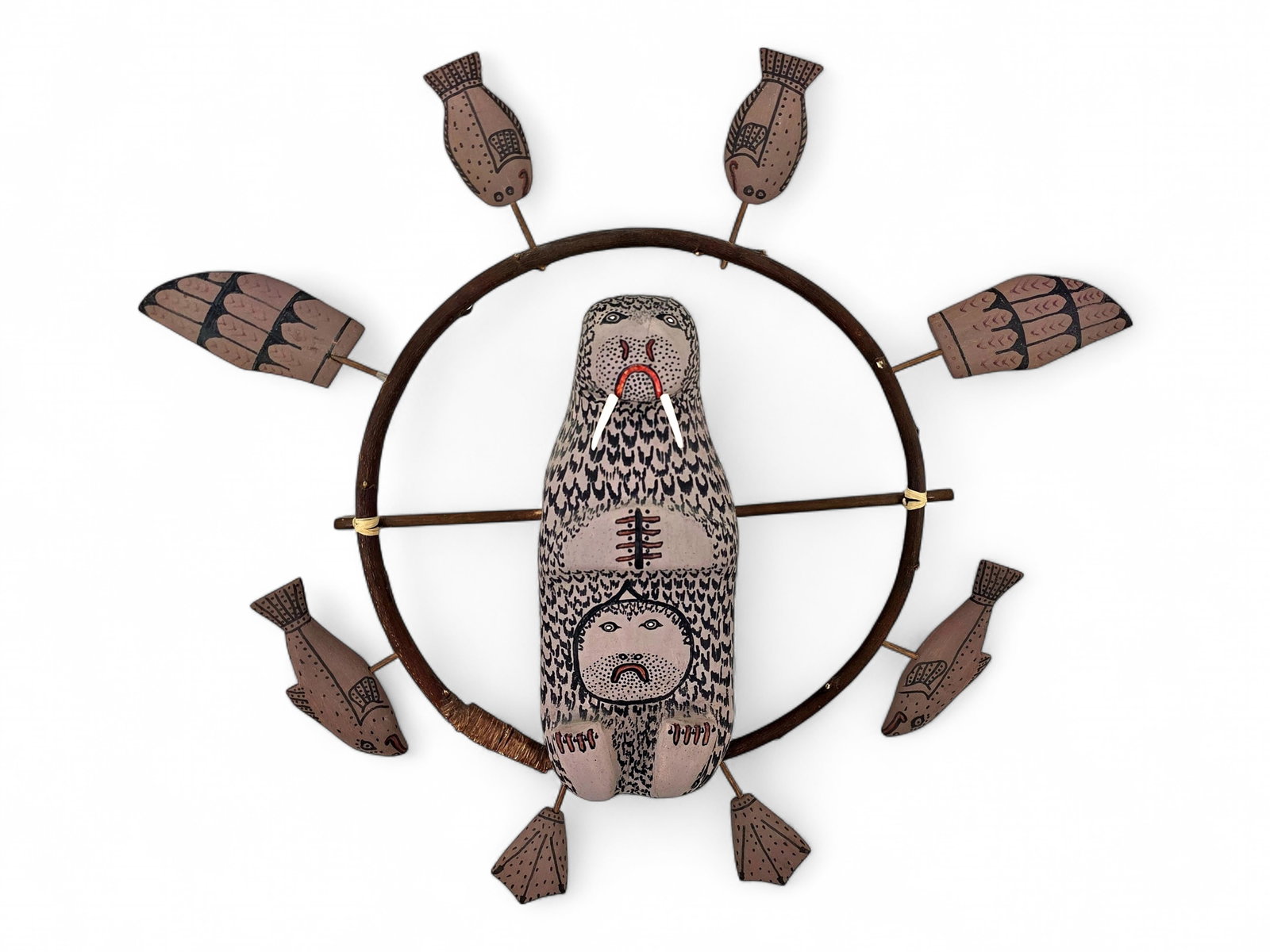 Nunivak Walrus Spirit Wheel - Henry Shavings: A polychrome Nunivak spirit wheel by the late artist Henry Shavings (1924–2016) of Mekoryuk, Alaska, distinguished by a painted treatment that departs from the artist's more familiar natural wood su