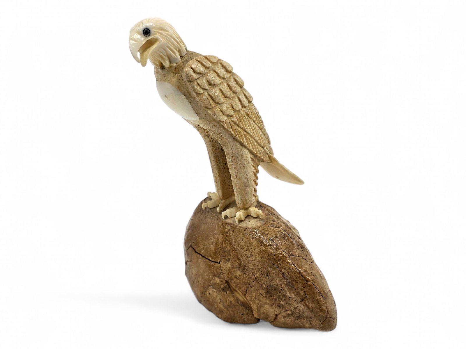 Walrus Tusk & Whalebone Eagle Figurine - Chris Aningayou: A striking bald eagle sculpture by Chris Aningayou (b. 1983), a contemporary Siberian Yupik artist of St. Lawrence Island heritage residing in Nome, Alaska. Raised within the rich carving traditions o