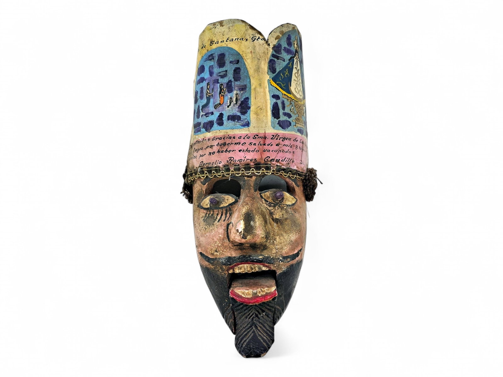 Mexican Milagro Ex-Voto Folk Art "Miracle" Mask: An ex-voto milagro folk art mask depicting a Moor, hand-carved from wood and painted with expressive features accented by two striking purple glass-like pupils, created for the annual Danza de Moros