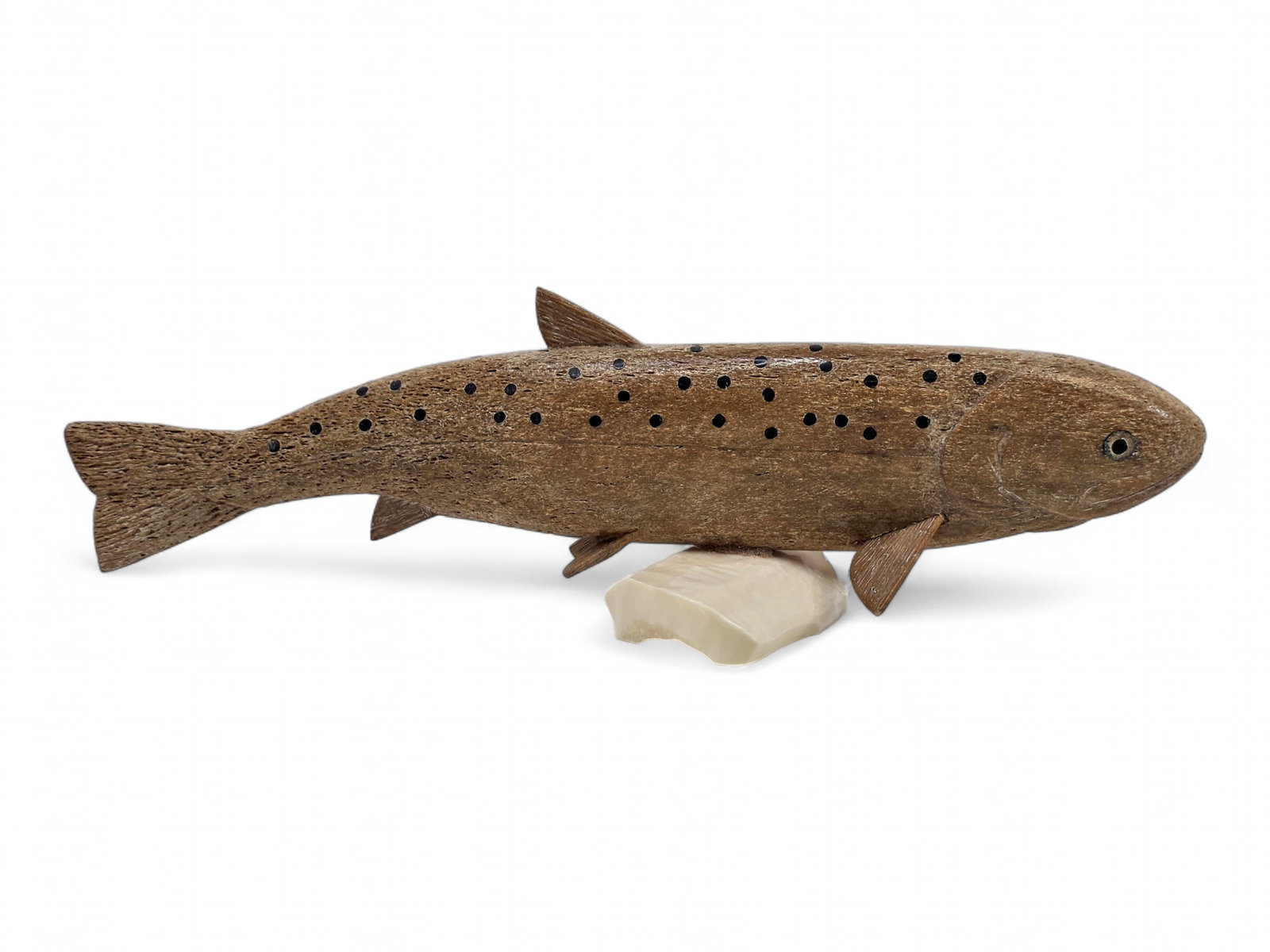 Large Carved & Baleen Inlaid Mineralized Bone Salmon Carving - Aaron Oseuk Sr.: A striking Arctic sculpture depicting a salmon masterfully carved from mineralized whalebone and mounted atop an organically formed walrus tusk base. The porous, naturally textured surface of the anci
