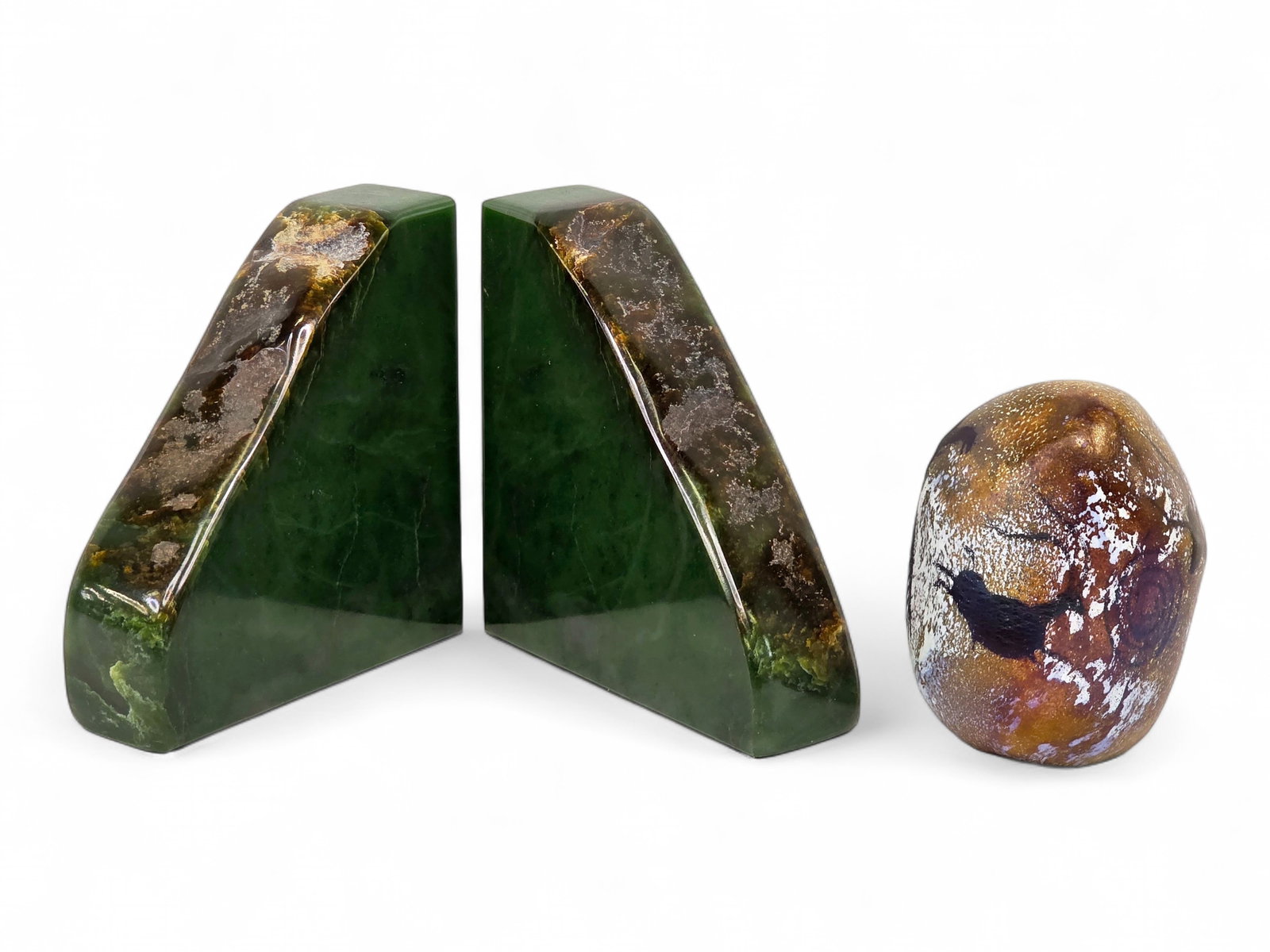 Kobuk Valley Jade Bookends & Richard Satava Art Glass Paperweight: A beautiful pair of triangular-shaped polished jade bookends, crafted from a specimen processed by the Kobuk Valley Jade Co. which maintained a store in Girdwood at the base of Mount Alyeska for decad