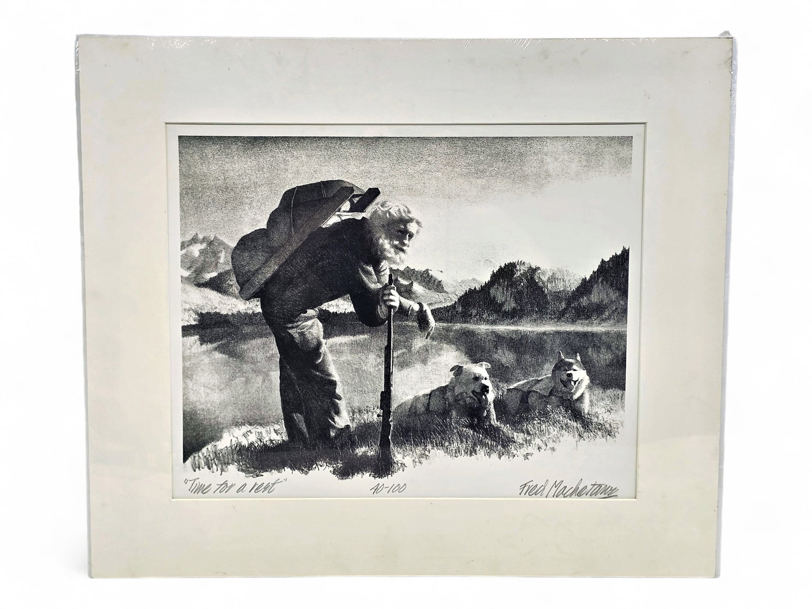 Fred Machentanz "Time for a Rest" Stone Lithograph: A stone-made lithograph c.1978 by the great late Alaskan artist, Fred Machetanz (1908-2002) entitled "Time for a Rest". The work depicts two pack dogs and an old Sourdough resting in the sun of a warm