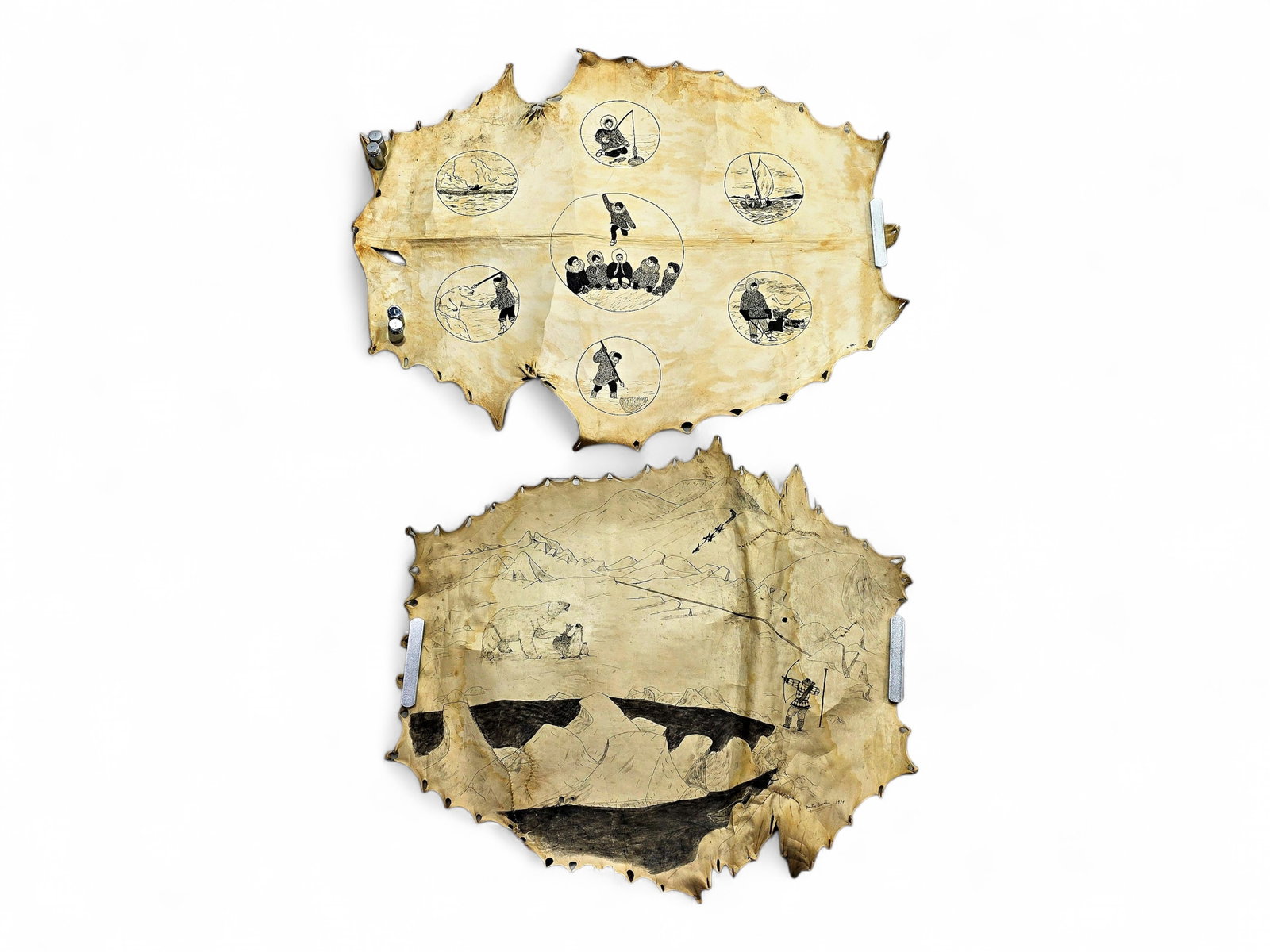 Two Alaska Native Ink Drawings on Seal Hides: A pair of traditional Native Alaskan ink drawings, each intricately rendered on stretched seal hide. The primary artwork features a collection of intricate vignettes set within circular borders, captu
