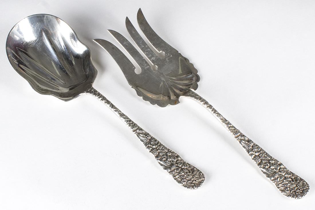 STIEFF Sterling Silver Serving Utensils Floral Pattern: Lot of 2 Stieff "Chrysanthemum" pattern serving utensils, possibly salad fork and spoon.Fork is 9.5" long and is engraved with an "F" on the reverse. Weight is 3.485 troy ounces. Spoon is 9.25" long a