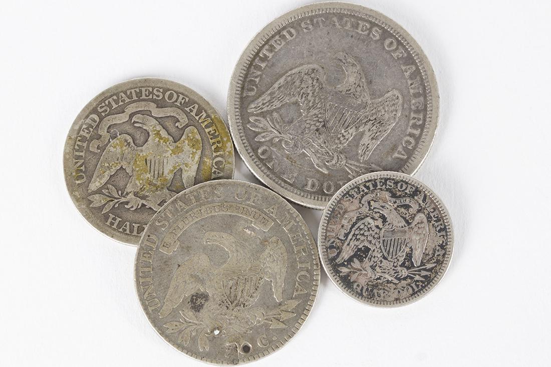 Lot of 4 US Silver Coins from the 1800's: Lot of 4 silver US coins. 1818 Bust half dollar. 1875 Seated Liberty Quarter Dollar. 1877 Seated Liberty Half Dollar. 1840 Seated Liberty One Dollar. Each coin is 90% fine silver.