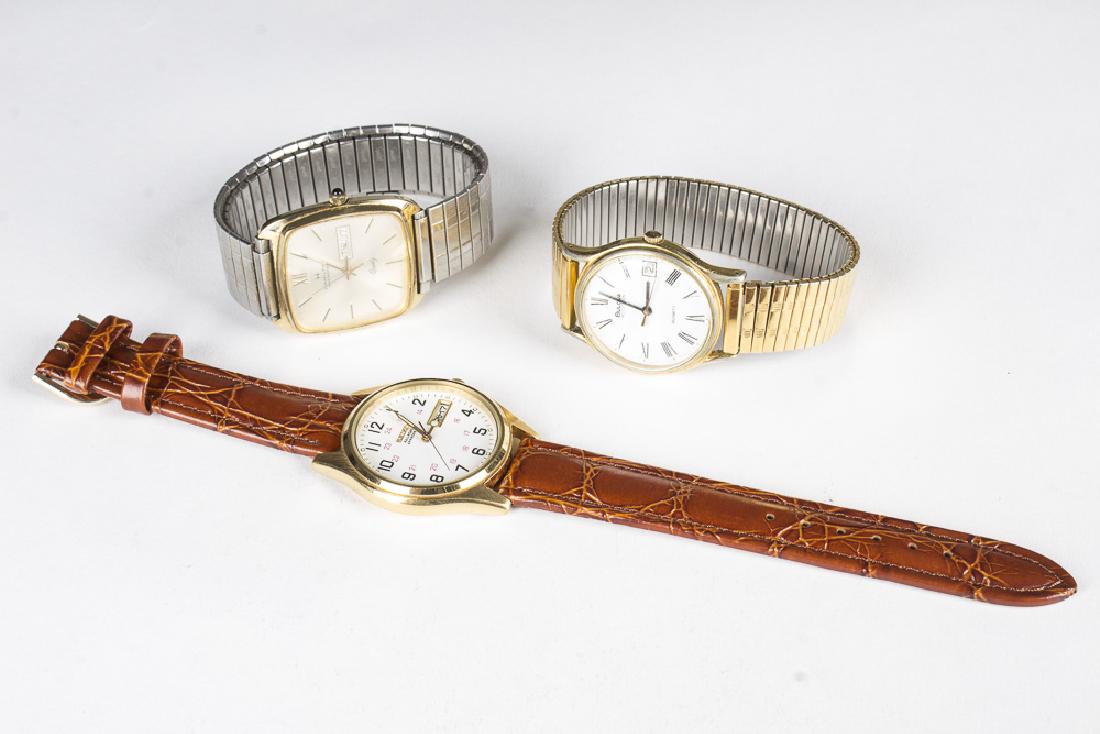 Lot of 3 Vintage Quartz Watches...Hamilton, Bulova,: A. Hamilton Masterpiece Quartz with Day/Date window at 3 position. Silvertone face with gold hands and minute marks, center mounted sweep second hand.32mm rectangular face. 20mm lugs. Stainless steel 