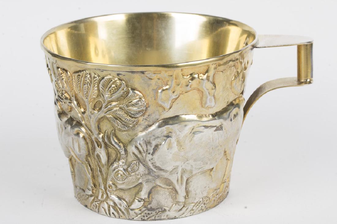 Ilias Lalaounis Mythological Silver Mug: An ornate 0.900 pure silver mug, created by legendary Greek artist Ilias Lalaounis. The mug depicts the 7th labor of Hercules, namely the capture of the Cretan Bull. This fanciful depiction of Greek