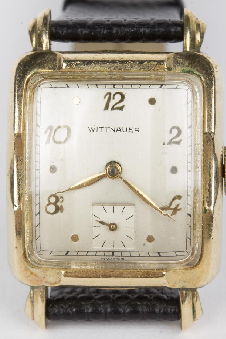 Wittnauer 17 jewel Tank Style Hand Wind Wristwatch: A vintage Wittnauer Swiss made 17jewel hand wind tank style wristwatch, with 10KT gold filled case and stainless steel back. Movement is Swiss 10S. White face with golden Arabic numerals and golden ha