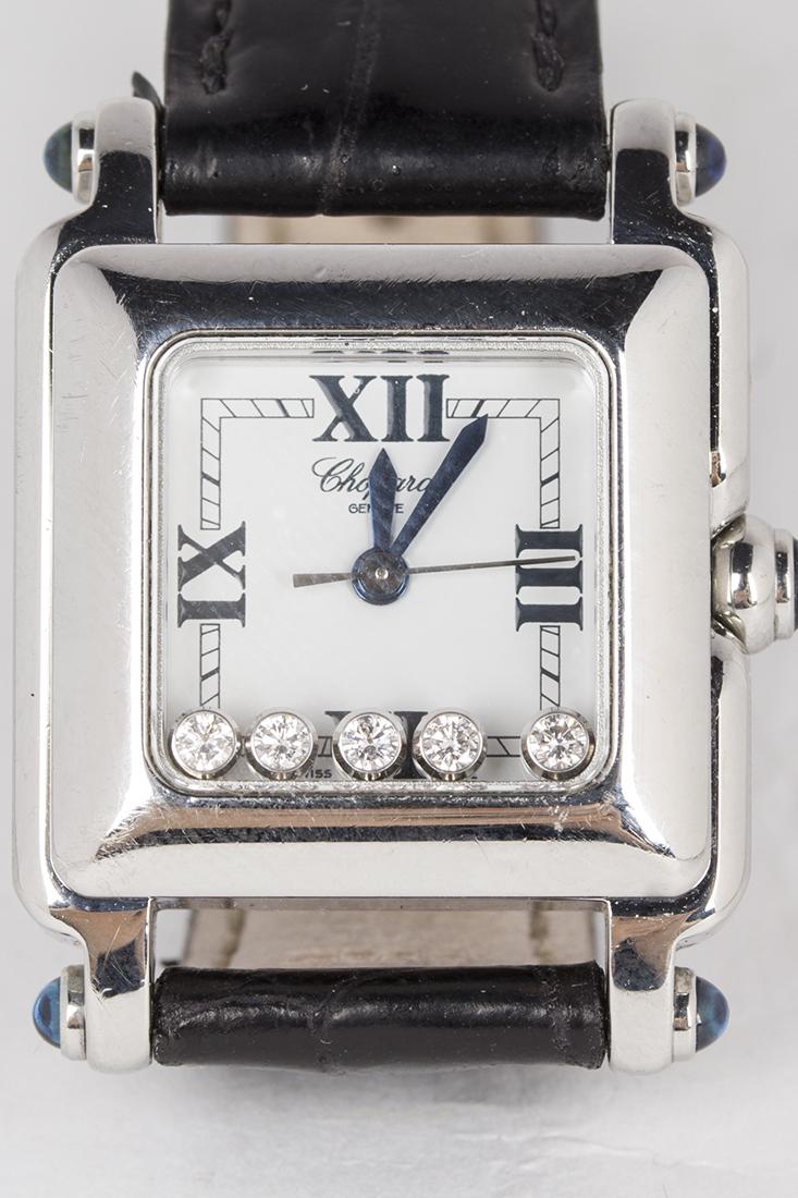 Chopard Happy Sport Swiss Made Quartz Wristwatch: Chopard Happy Sport Swiss made quartz wristwatch. Stainless steel case and bezel. Black Roman numerals with center mounted hands. 22mm case with 9mm lugs. Contained within the watch and floating above