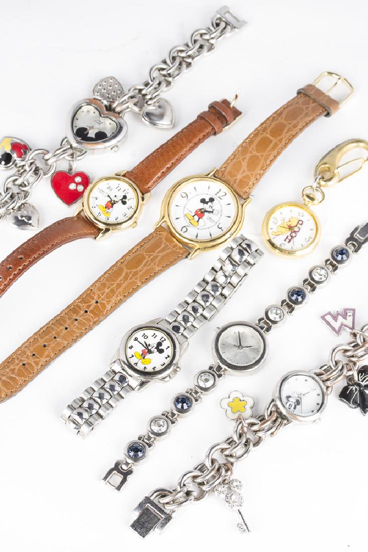 Collection of 7 DISNEY Watches: 7 watches of various styles, all featuring Disney characters. 3 quartz Mickey Mouse watches, featuring Lorus, 2 with leather bands and 1 all stainless. All functioning. Winnie the Pooh hanging clasp q