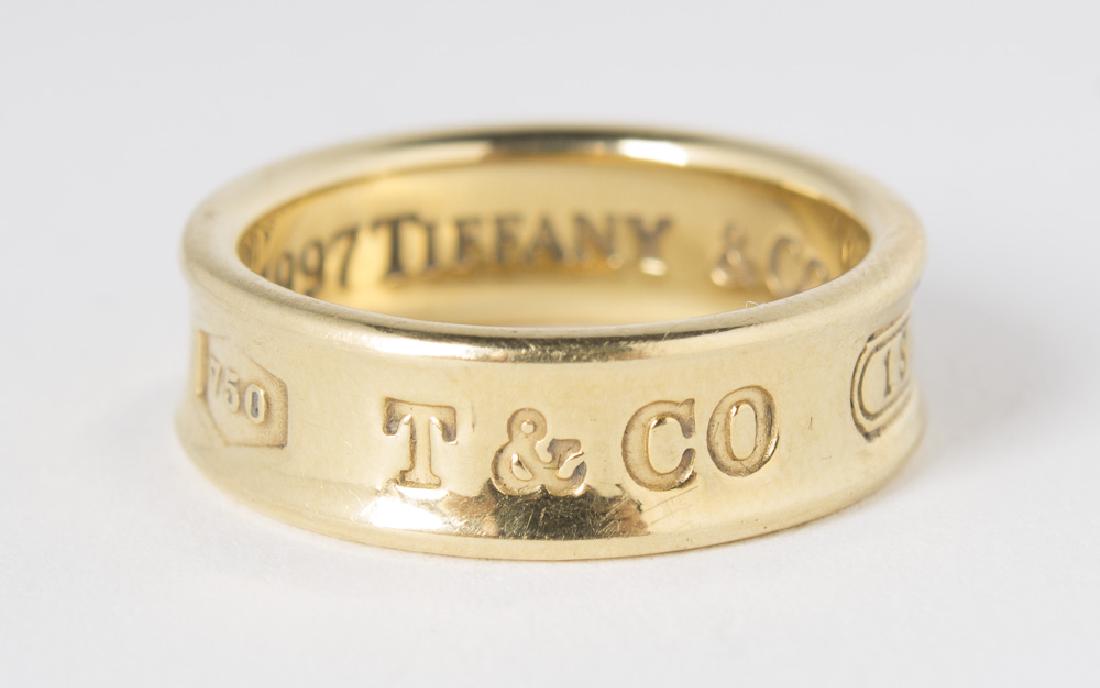 1997 TIFFANY & CO 18KT Yellow Gold Ring: A 1997 Tiffany & Co 18kt yellow gold ring. Outside stamped as follows: "750/ T & CO/ 1837". 7.90grams Size 7