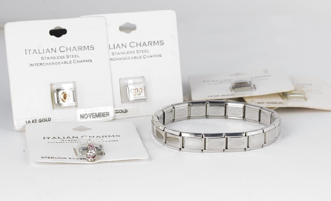 Italian Charms 18KT Accents & Bracelet: 5 Italian charms with 18kt gold accents, ranging from a star, Olympic rings, books, and others. 1 sterling charm with a ruby and diamond flip flop. The bracelet, stamped "Charmed Expressions Italy", i