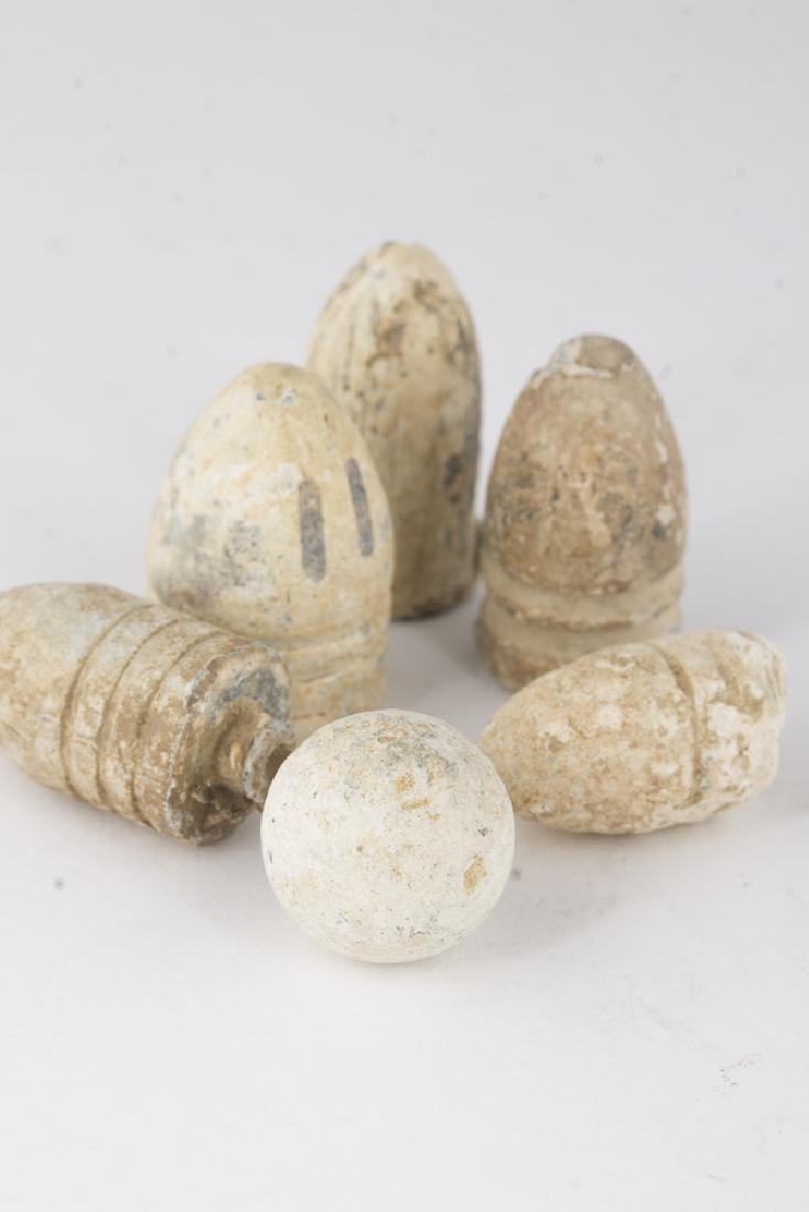 Civil War Collection of USA, CSA Minie Balls & 0.50 Cal: This collection of US Civil War ammo contains 2, 3 ring USA minie balls; 2, 2 ring CSA minie balls; one minie ball which is unidentifiable, and one 0.50 caliber musket ball.