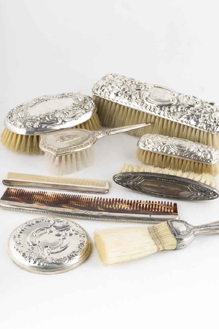 Vintage Collection of Sterling Accented Grooming: Vintage collection of grroming brushes, combs and a hand mirror, all accented with sterling silver. Includes Wallace, Gorham, and Webster sterling. Types include large clothing brushes, nail brushes, 