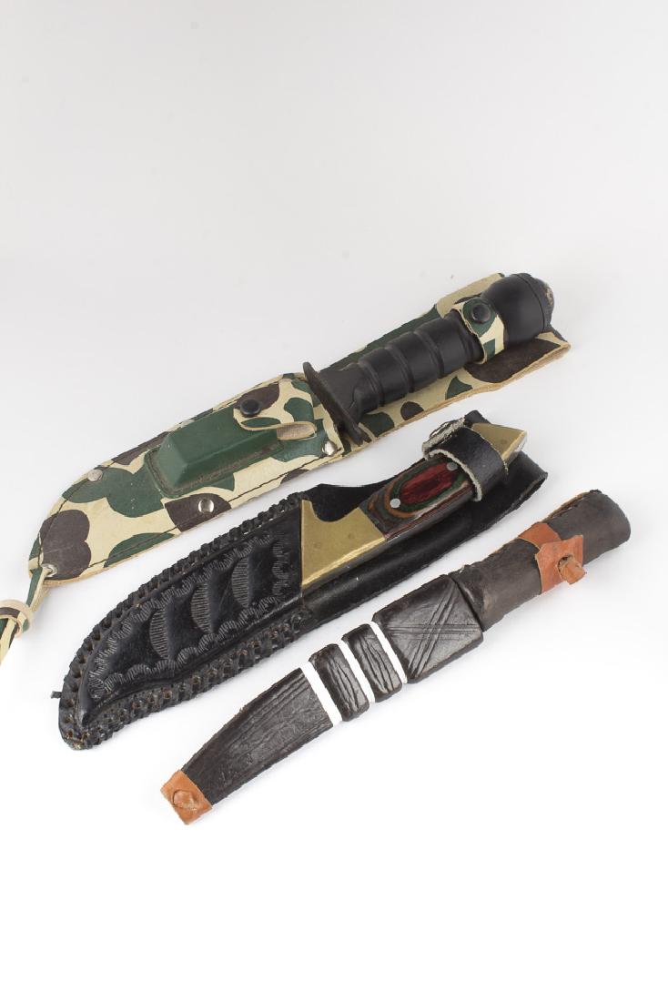 Lot of 3 Sheath Knives: Lot of 3 Sheath Knives. 1. Chipaway Cutlery. Unusual absent center blade. Handle of multicolored wood, brass bolsters, full tang. Black leather sheath. Approx 4" blade. 2. Handmade outdoors knife. Fil