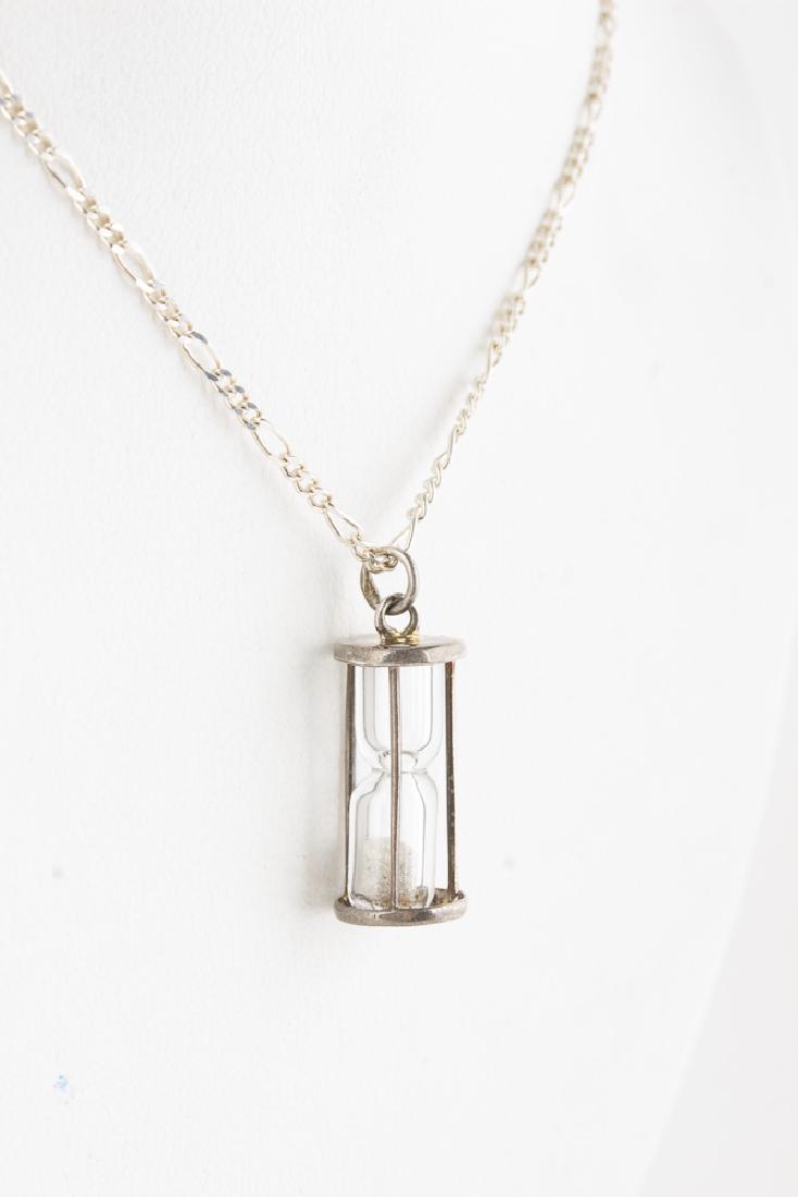 Sterling Silver Designer hourglass Pendant on Necklace: Sterling Silver Designer Pendant on 24in Sterling Silver Necklace. Designer Ibe Dahlquist worked with George Jensen. 5.7g total.