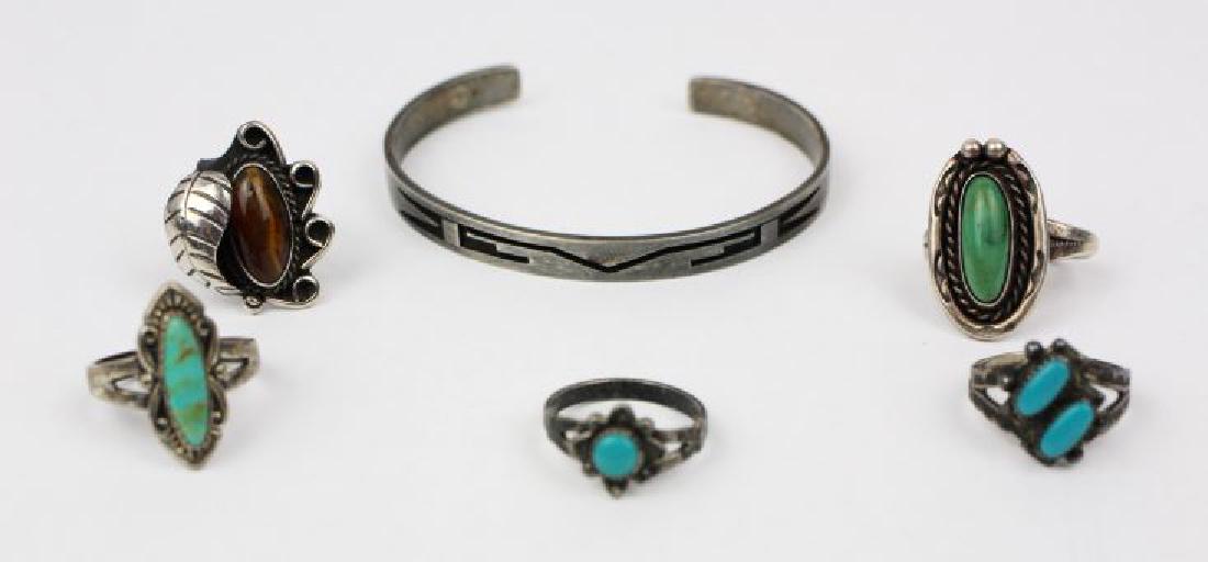 Native American Sterling Silver Lot 5 Pieces Bracelet: American Indian Sterling Silver Lot. 5 Pieces, Bracelet and 4 Rings Turquiose, Tigers Eye. Sizes 5.75, 4.5, 4.25, 5. 2 Bell Trading Company Rings, Bracelet 2.25in widest diameter, Artisan Marked for H