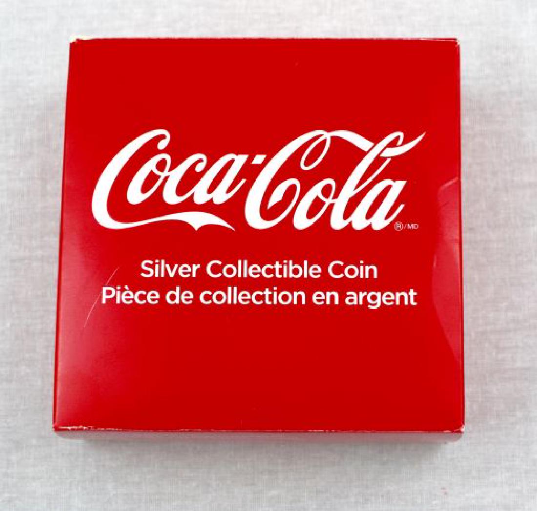 Coca Cola Silver Collectible Coin: Coca Cola Silver Collectible Coin. .999 fine Silver Proof, six grams. One Dollar 2018 Fiji. Set in Coca Cola Bottle cap design.