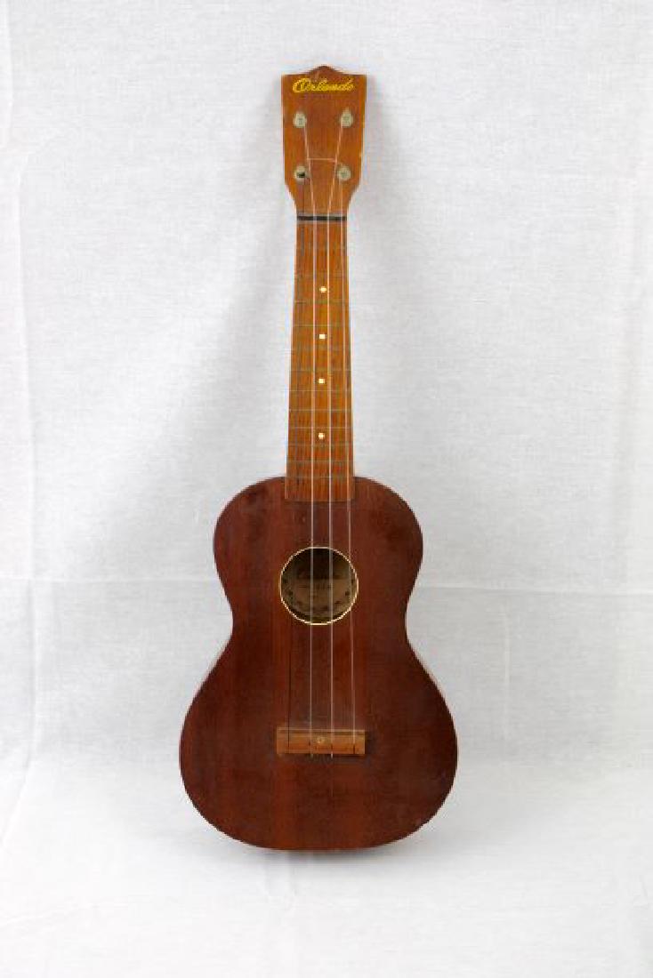 Orlando Ukelele: Orlando Ukelele, model 338. 22.5in x 8in. Concert size, made in Japan. Mahogany construction, good playable condition. Some wear, dents, and scratches. Extra $25.00 surcharge for shipping, this item o