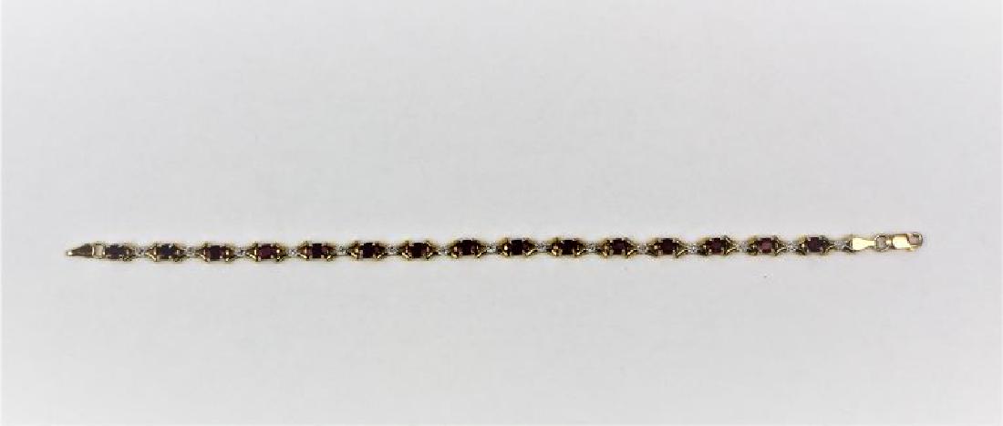 Designer Diamond and Ruby Bracelet 14KT Yellow Gold: ADL 14KT Yellow Gold designer bracelet w\ alternating accent diamond and ruby links, 7in length. 15 1mm diamonds w/ 15 rubies 4.2mm x 3.1mm. Secure lobster clasp. 6.1g