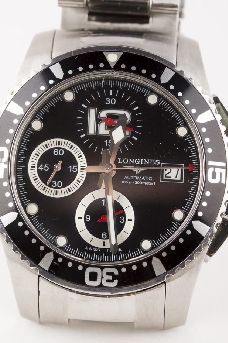 LONGINES Hydro Conquest Swiss Chrono: Longines Hydro Conquest Swiss chrono wristwatch with date window at 3 position and 3 subdials. Stainless steel case, bezel, and band. Black face with white luminescent minute marks. Arabic 12 o'clock 