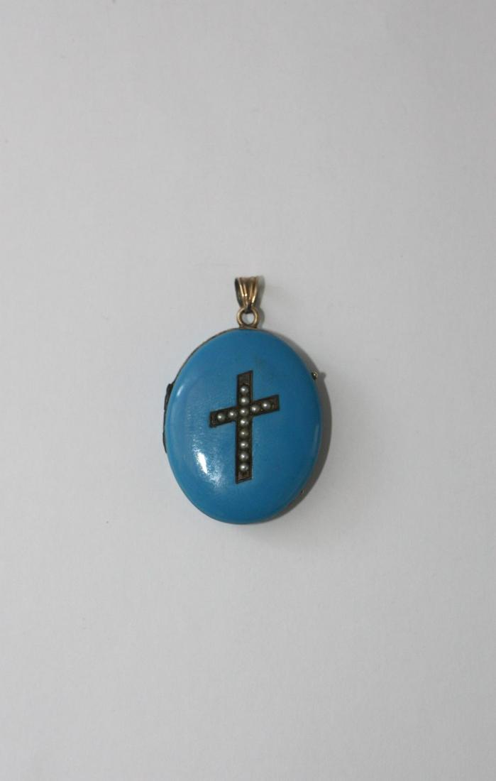 Mourning Pendant in 10KT with Enameling: A mourning locket/pendant, made of 10kt gold which features blue enameling on both the front and back, while the front features an inscised cross featuring 12 small pearls. Inside are 2 compartments f
