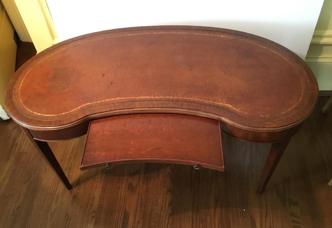 MAHOGANY KIDNEY SHAPED COFFEE TABLE: Kidney shaped coffee table with Leather top and slide out drawer
