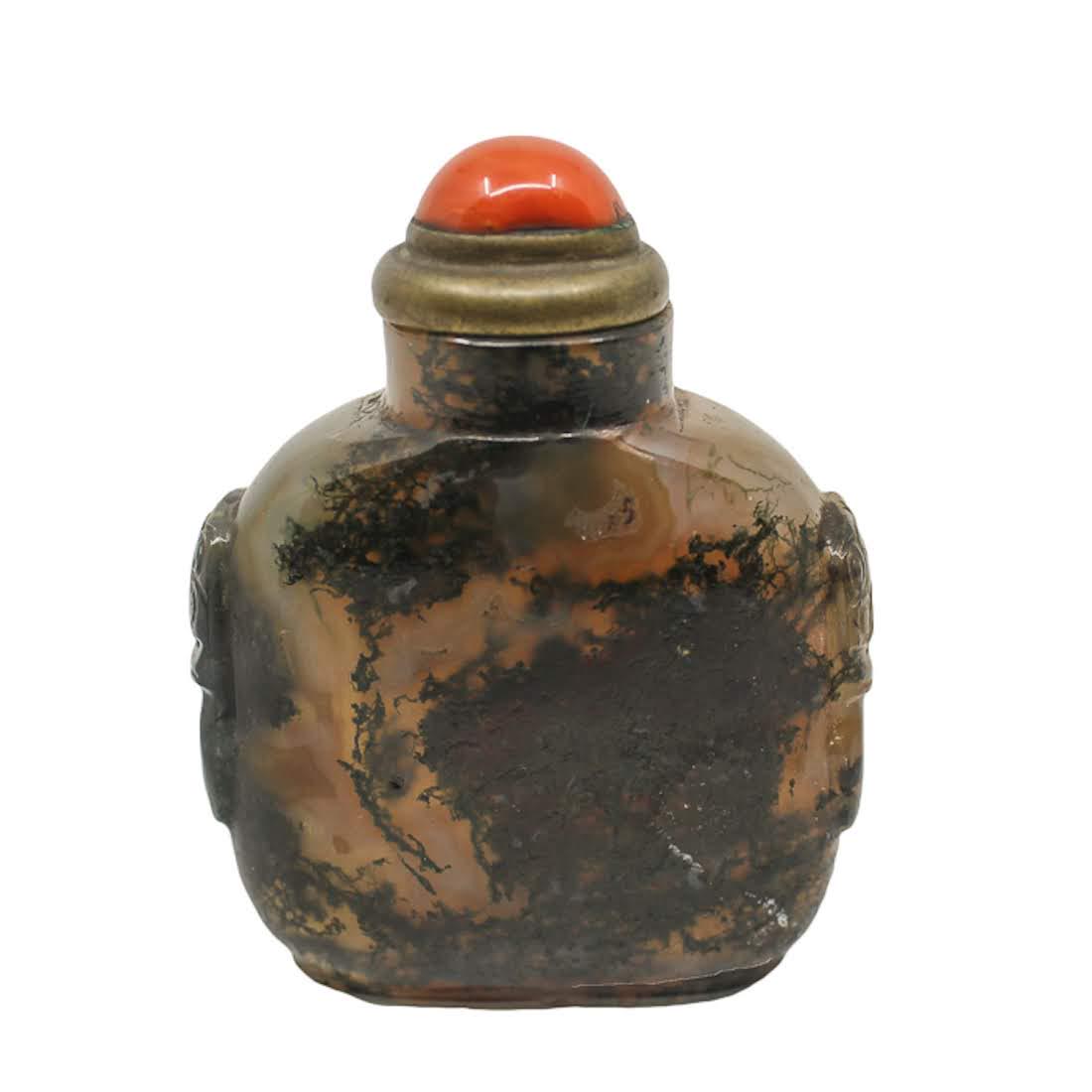 Antique Chinese Moss Agate Snuff Bottle: An antique Chinese moss agate snuff bottle. This piece features hand-carved decorative "handles" on each side. It has a coral stopper and bone spoon. Dimensions: 3.25 x 2.5 x 1.5 Flat Rate Shipping (n