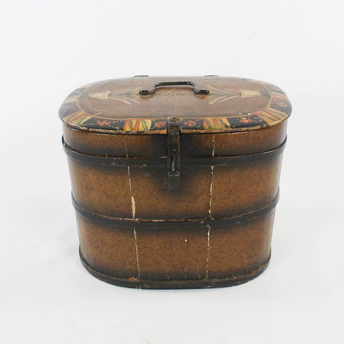 Antique Swedish Signed Iron-Bound Wooden Box: An antique Swedish iron-bound wooden box. This piece features hand-painted designs on the lid. It is signed with the initials "JG". Dimensions: 15 x 16 x 13 Flat Rate Shipping (not calculated):