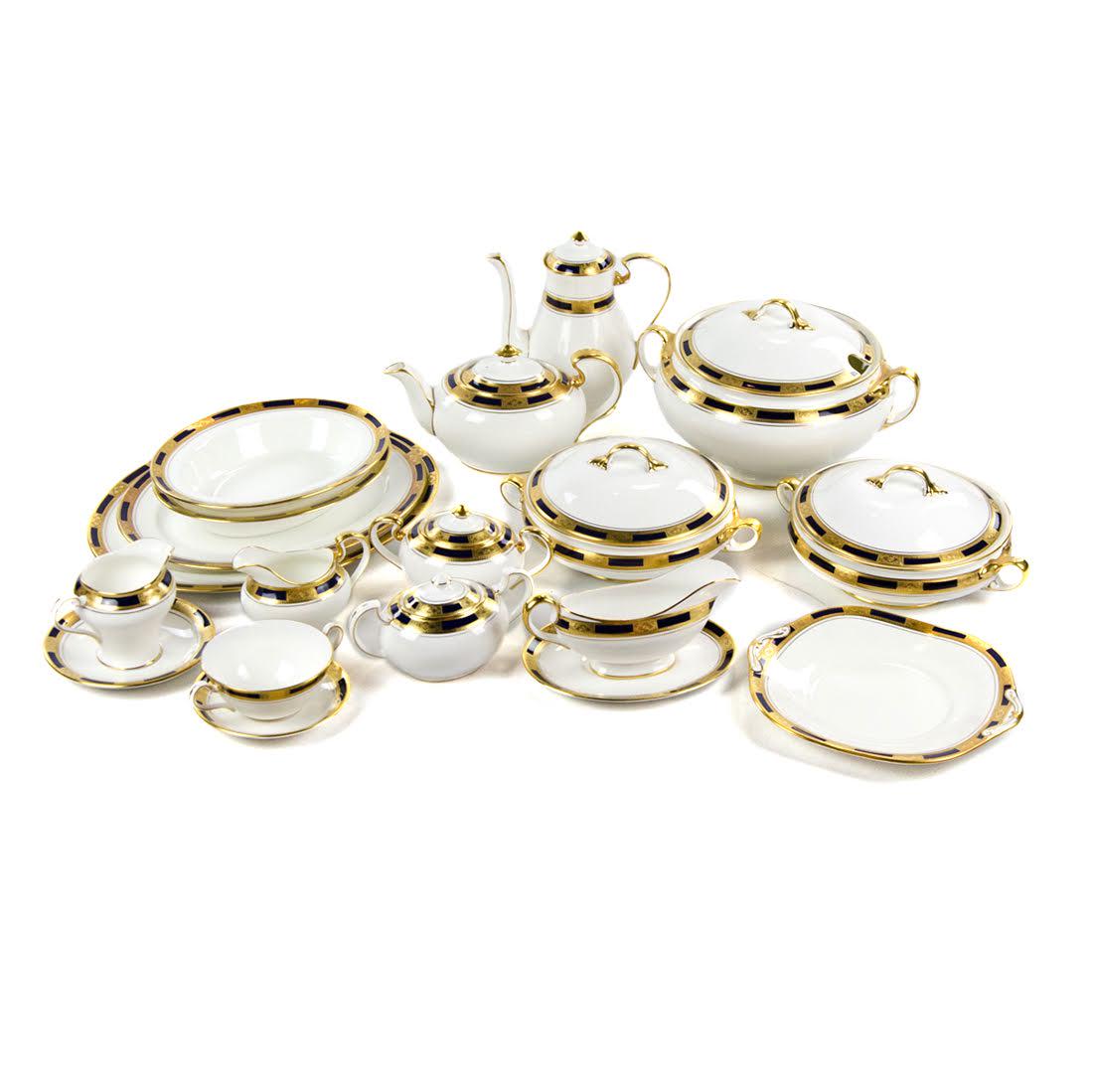 Aynsley "Empress Cobalt" China Service for Fifteen: A bone china service for fifteen by John Aynsley. This set features the "Empress Cobalt" pattern. Each piece showcases an ornate gilt and cobalt rim over a white base and is marked on the underside. T