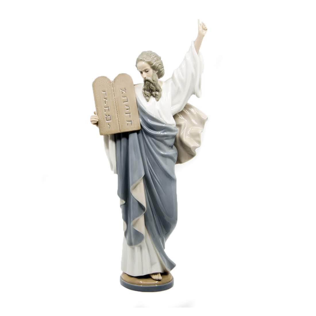 Lladró Moses Statue - 5170: A vintage Lladró statue of Moses. This piece depicts the prophet holding the ten commandments in one arm while pointing towards the sky with the other. Its model number is 5170. It is marked marked "