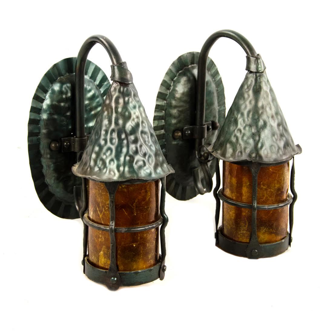 Pair of Mica Lamp Company Sconce Lanterns: A pair of vintage Mica Lamp Company sconce lanterns. Each features a iron construction and mica shade. The model number is 130-140. Dimensions: 11.5 x 5.5 x 8 (for one) Flat Rate Shipping (not calcula