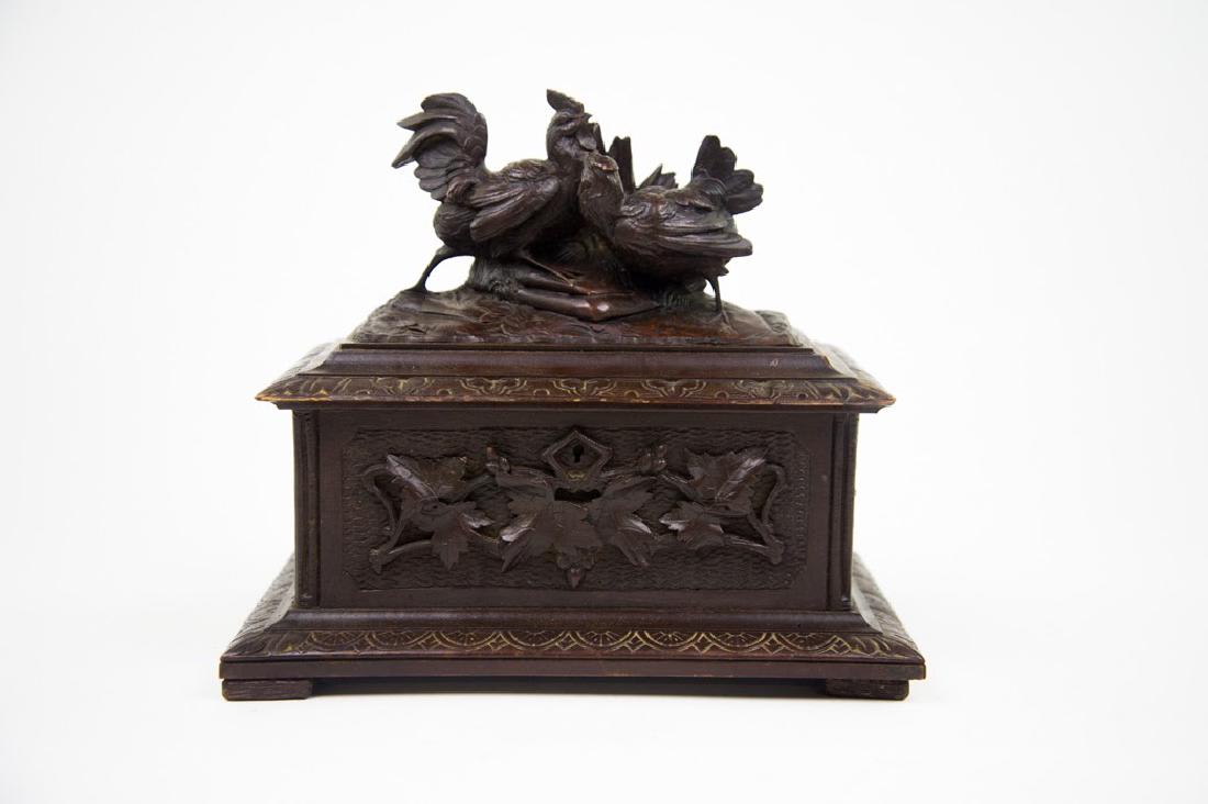 Antique Black Forest Rooster Tea Caddy: This antique Black forest tea caddy which is heavily carved came from a $100 million estate in Atlanta, GA. The piece features a locking lid with maple leaf raised carved features and holly berries. T